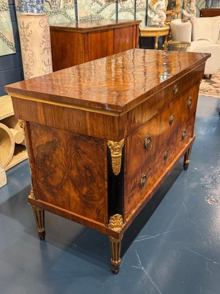 Outstanding period Austrian Biedermeier black walnut commode. You're exploring a piece that embodies early 19th-century elegance—an Austrian Biedermeier black walnut commode is a masterclass in restrained luxury, known for its clean lines, rich wood