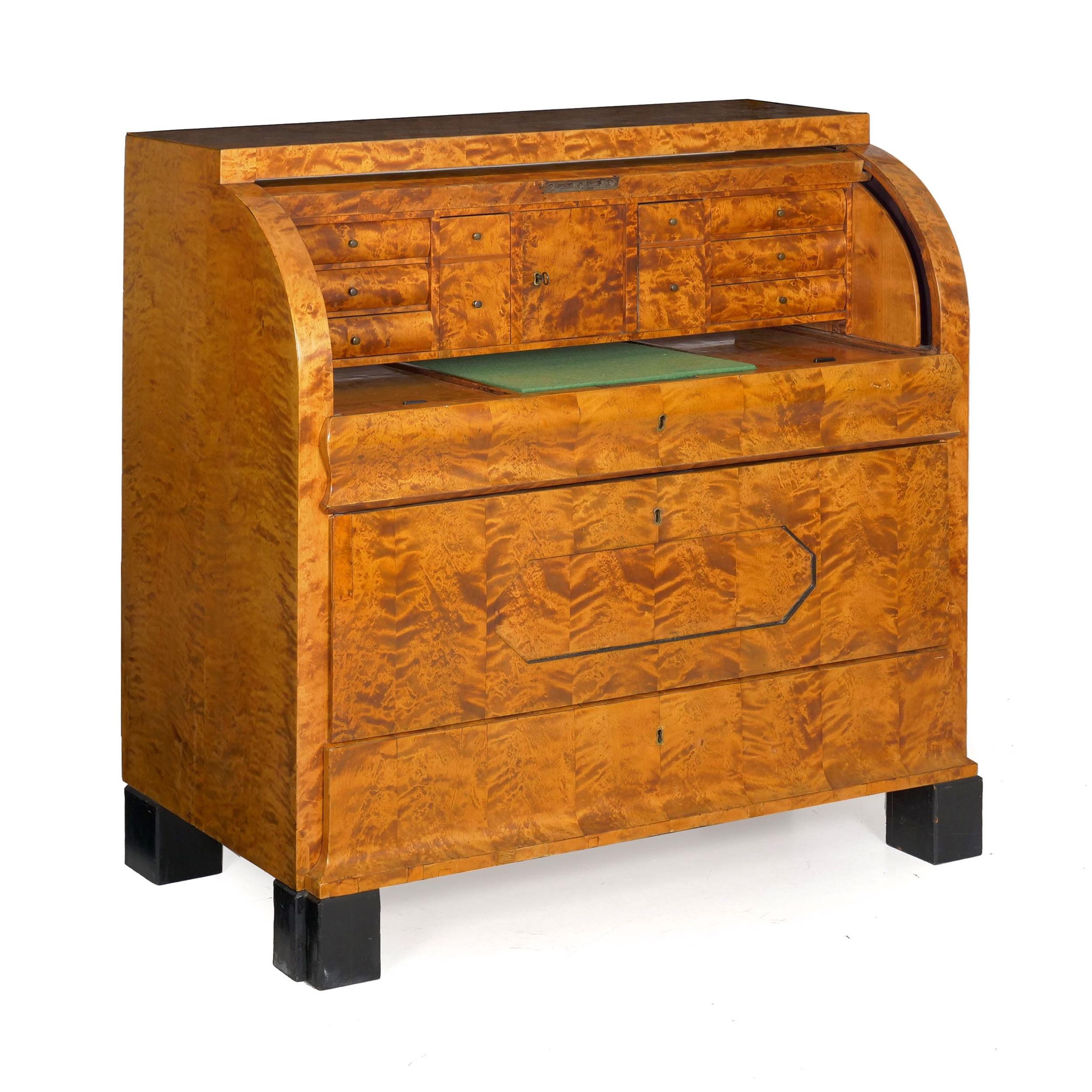 Biedermeier figured maple roll-top desk
Austrian, circa 1830-1850
Item # 007HQP30L

With rich and vibrant figured-maple veneers throughout, this fine Biedermeier writing desk features a rolling top that opens to reveal a series of six broader