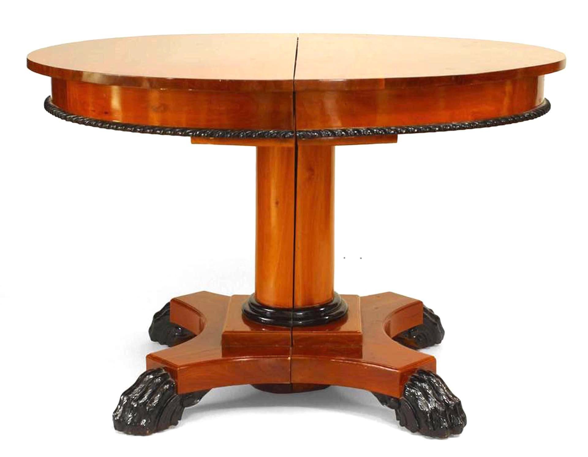 Austrian Biedermeier-style (modern) mahogany round pedestal base dining table with ebonized rope trim on apron and claw feet. (4 leaves with apron at 17.5
