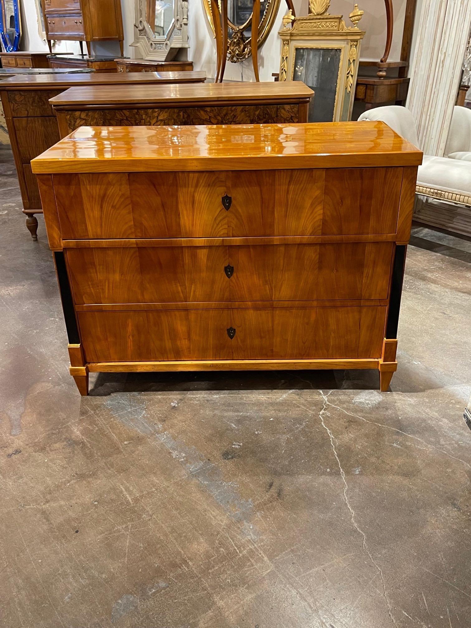 Very fine period Austrian Biedermeier walnut commode. This piece has an exceptional finish and beautiful clean lines. Also ebonized columns and 3 drawers for storage. Stunning!!