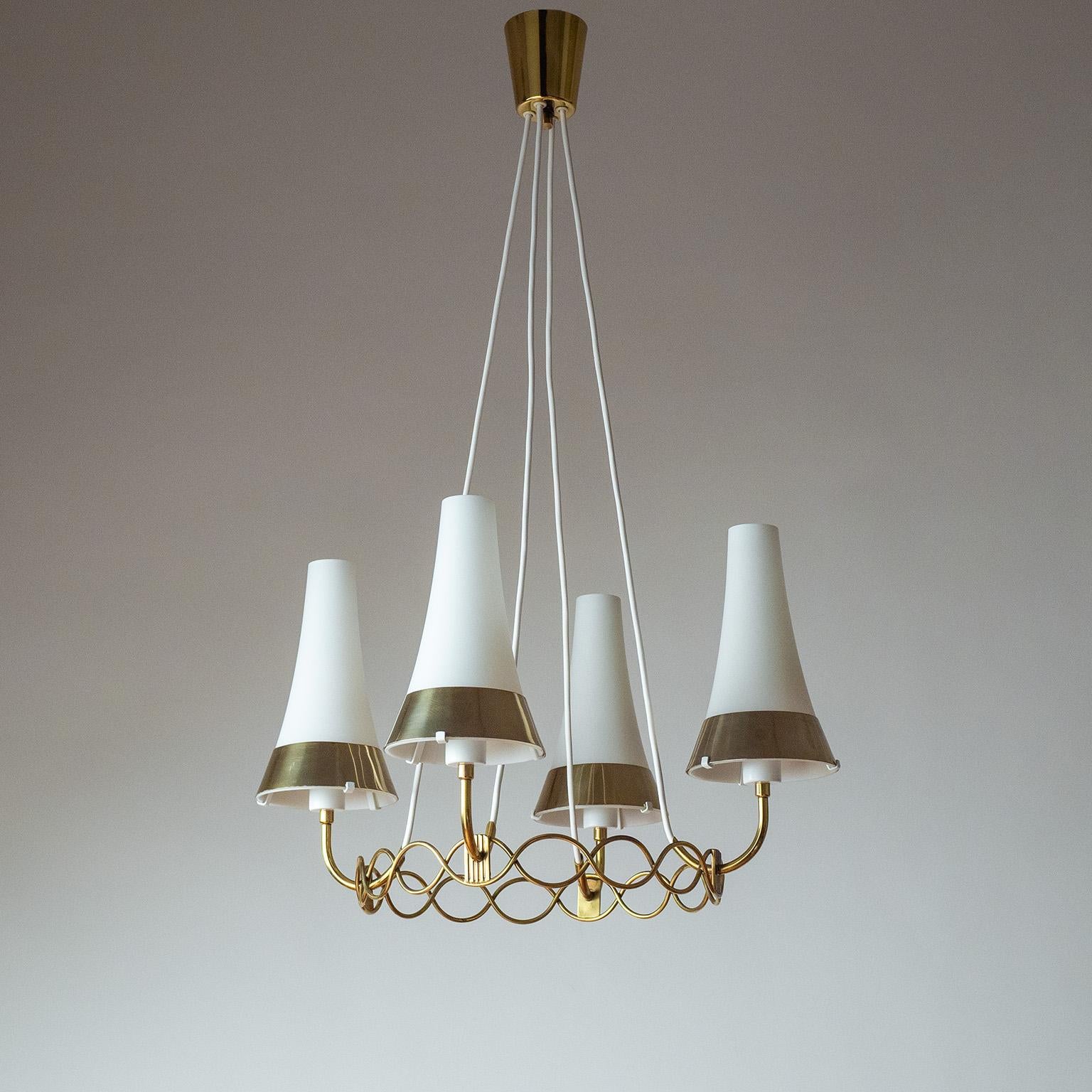 Delicate Austrian brass and glass suspension light from the 1950-1960s, attributed to Rupert Nikoll. An undulating brass ring holds four arms with slender, tapered satin glass diffusers. In addition, the glasses are partially covered by