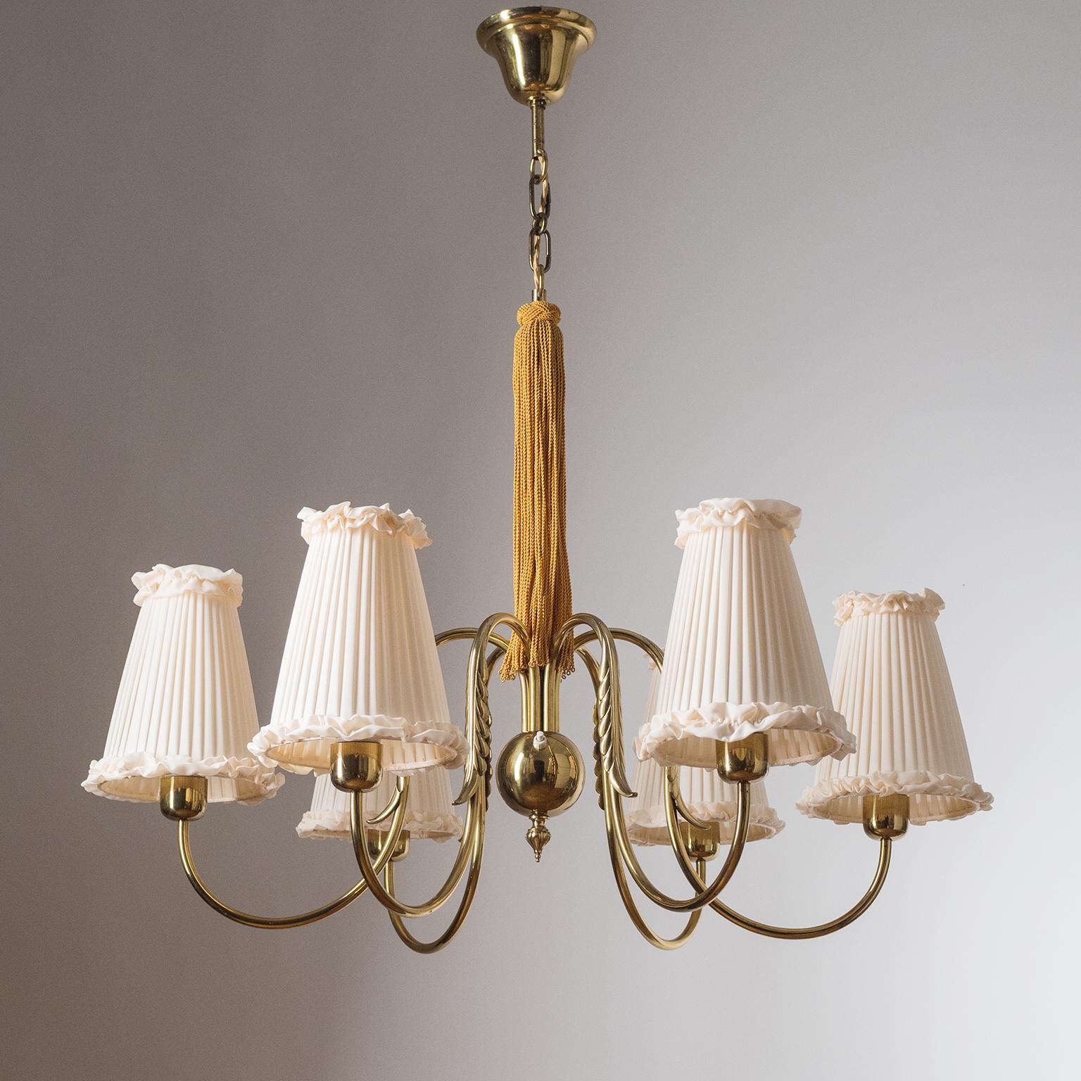 Rare Austrian 1930s brass chandelier, attributed to J.T. Kalmar. Six brass arms elegantly 'curve out' from a central brass ball and are decorated with cast brass leaf elements. Very good original condition with new custom shades. Six original brass
