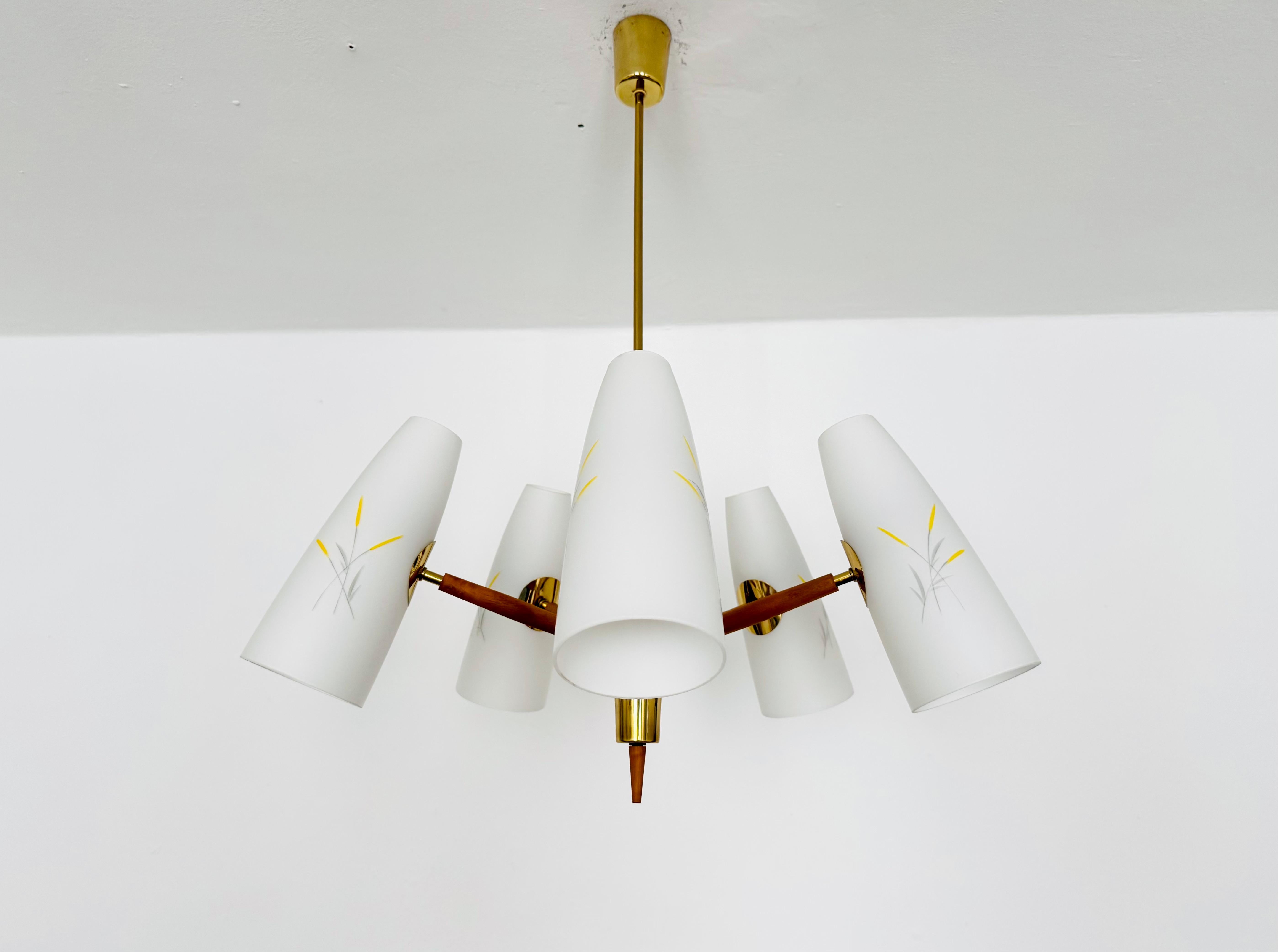Exceptionally beautiful chandelier from the 1950s.
This lamp is very rare and impresses with its loving details.
A stunning lamp and a true asset to any home.

Manufacturer: Rupert Nikoll

Condition:

Very good vintage condition with slight signs of