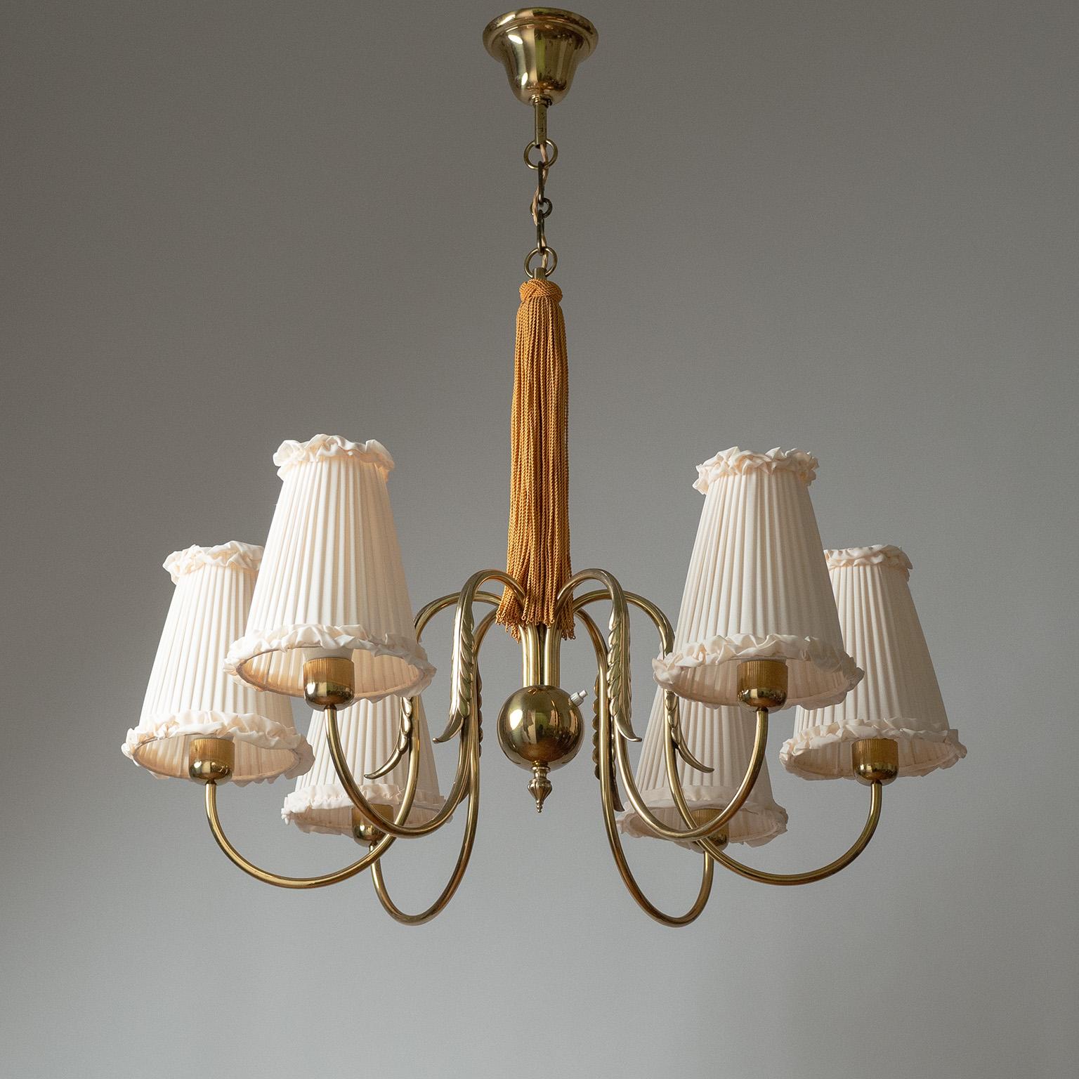 Rare Austrian 1930-1940ss brass chandelier, attributed to J.T. Kalmar. Six brass arms elegantly 'curve out' from a central brass ball and are decorated with cast brass leaf elements. Very good original condition with newer shades. Six original brass