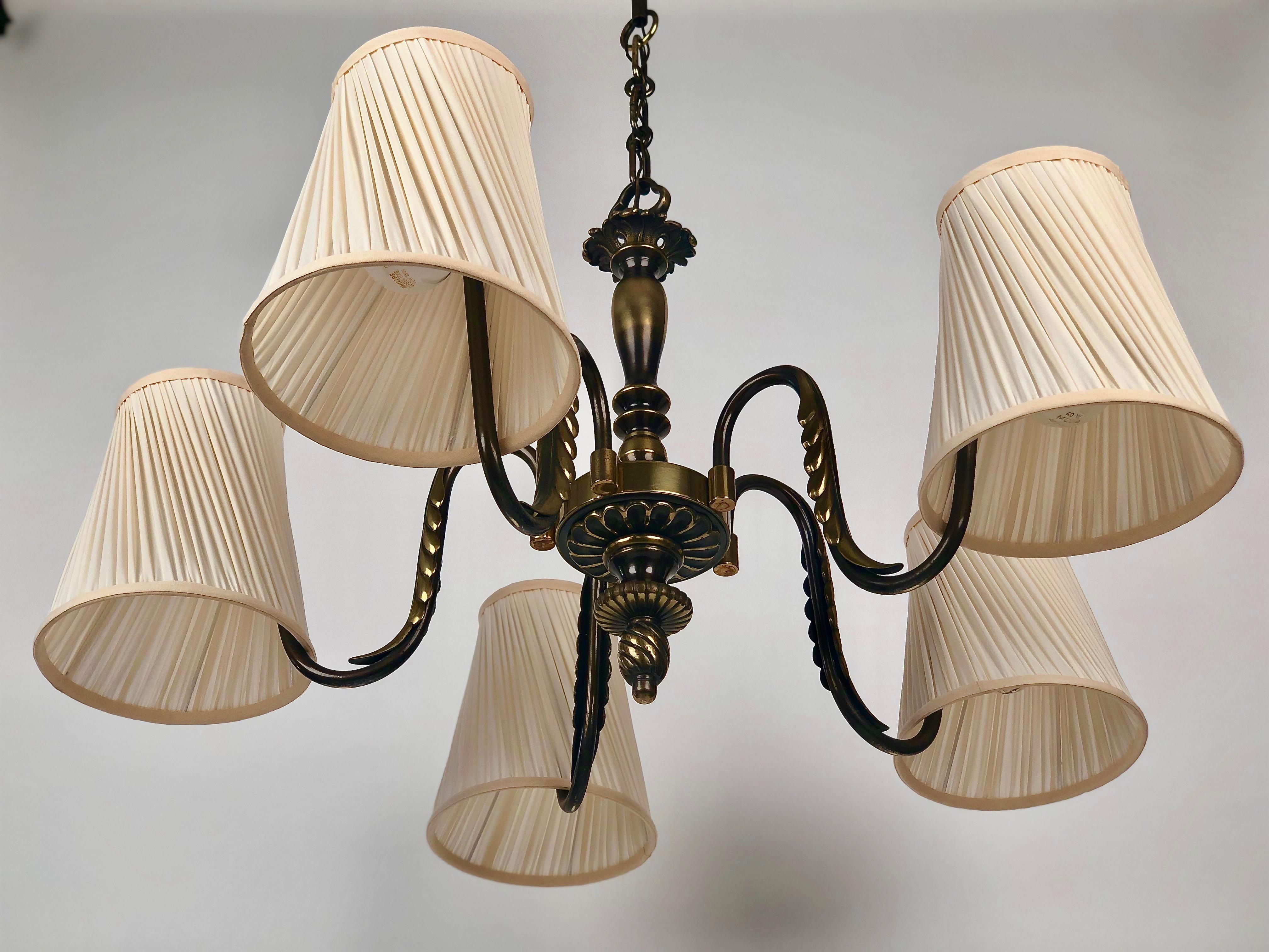 Classic Viennoise chandelier from 1930´s. 
Very precisely made from brass and bronze elements.
The shades are made new in cream coloured silk using the original frames.
The electric has been controlled. 