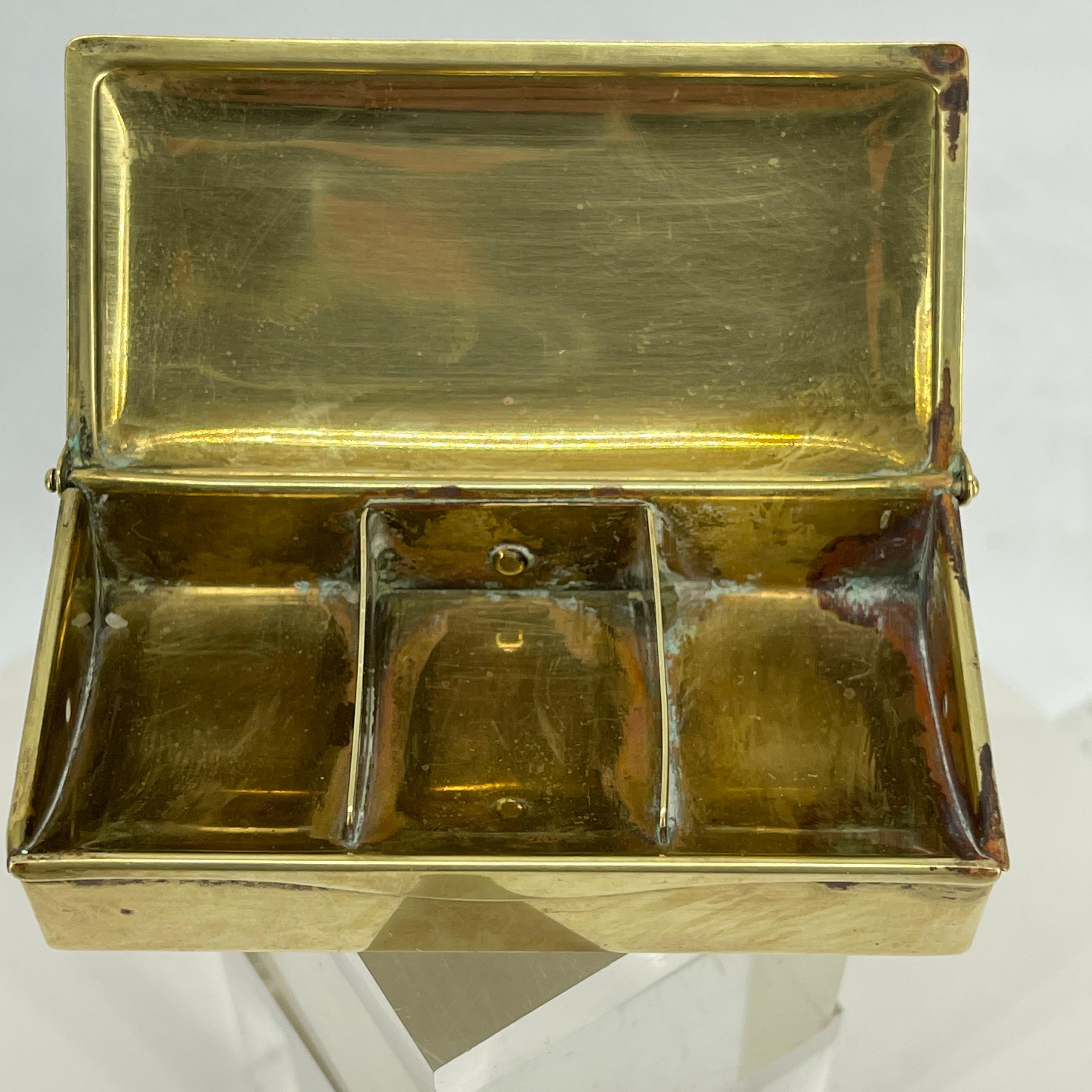 Charming 3 compartments brass stamps storage box. The box is in good working condition and has that warm patina feel, of having tonnes of history behind it.
The box can also be used for rings and pendants.
Marked GES.GESCH AUSTRIA.