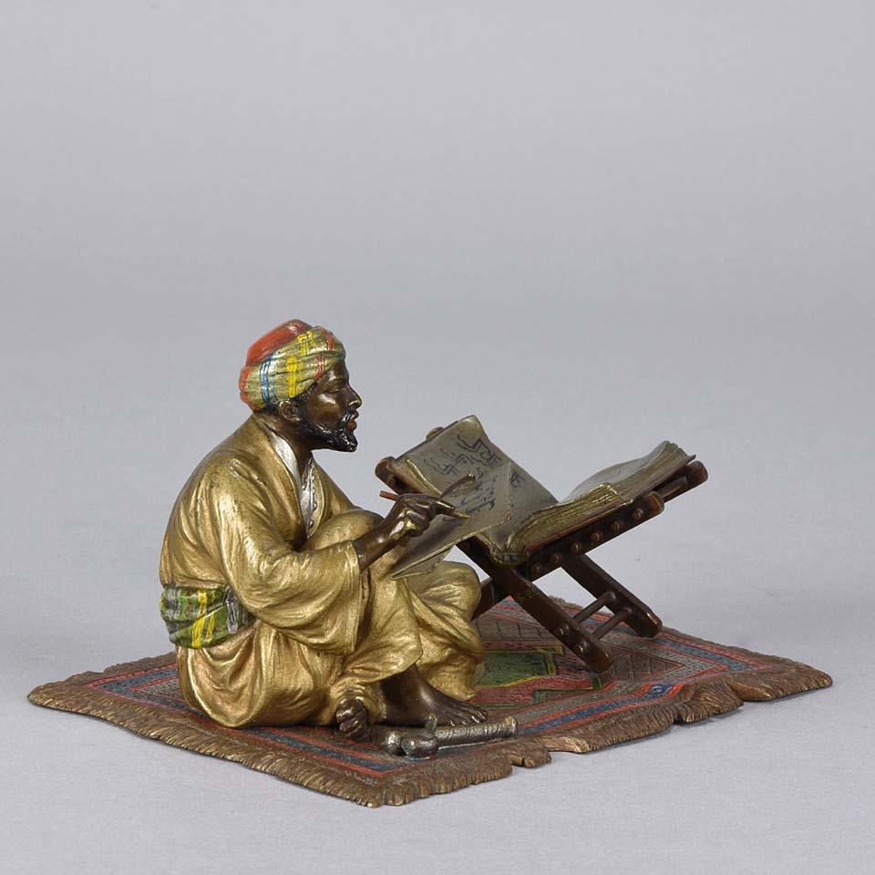 A fabulous early 20th century Austrian bronze figure of a seated Arab scribe seated upon an Orientalist rug whilst taking notes with excellent cold painted colors and fine intricate hand finished detail, signed with the Bergman 'B' in an amphora