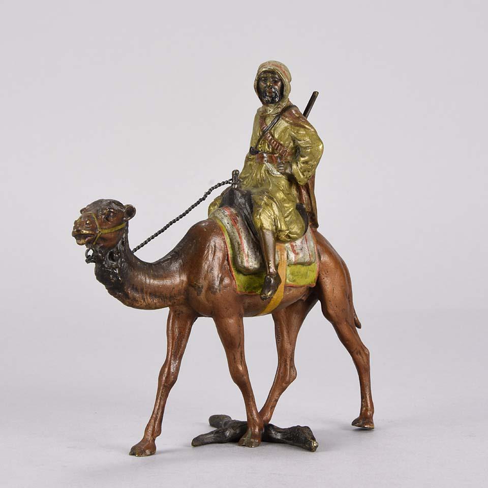 Very fine cold painted Vienna bronze study of an Arab Warrior with rifle mounted on his camel. The surface of the sculpture with good hand chased detail and fine naturalistic color, signed with the Bergman ‘B’ in a vase.
 