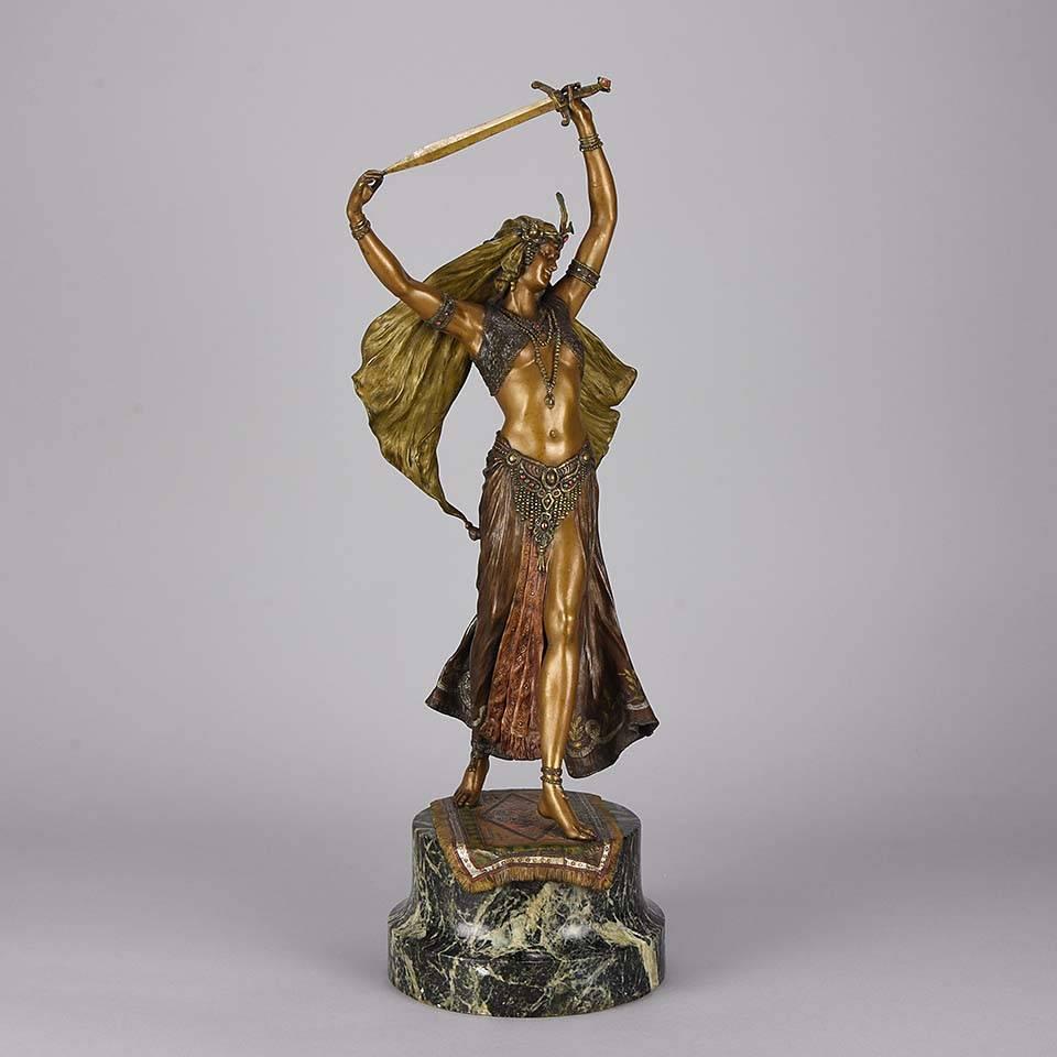 A magnificent early 20th century Austrian bronze figure of an orientalist beauty dancing with a sword lifted above her head. The bronze with excellent cold painted color and very fine detail, signed with the Bergman ‘B’ in an Amphora vase.