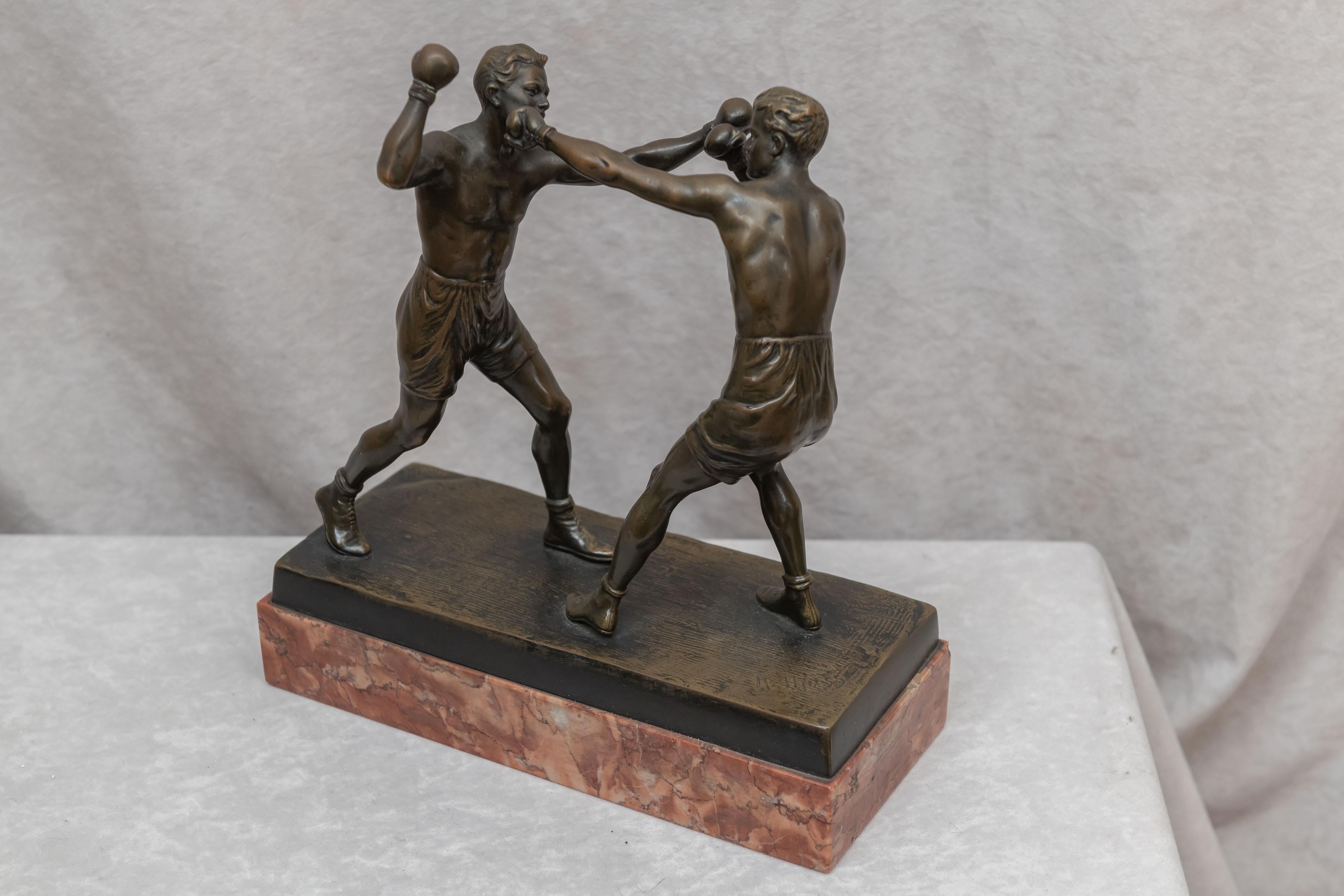 We are always on the lookout for sports subject matter in our quest for antique bronzes. Boxing is right up at the top of our list. This high action, well modeled example of 2 boxers engaged in their sport is exactly the kind of work we are looking
