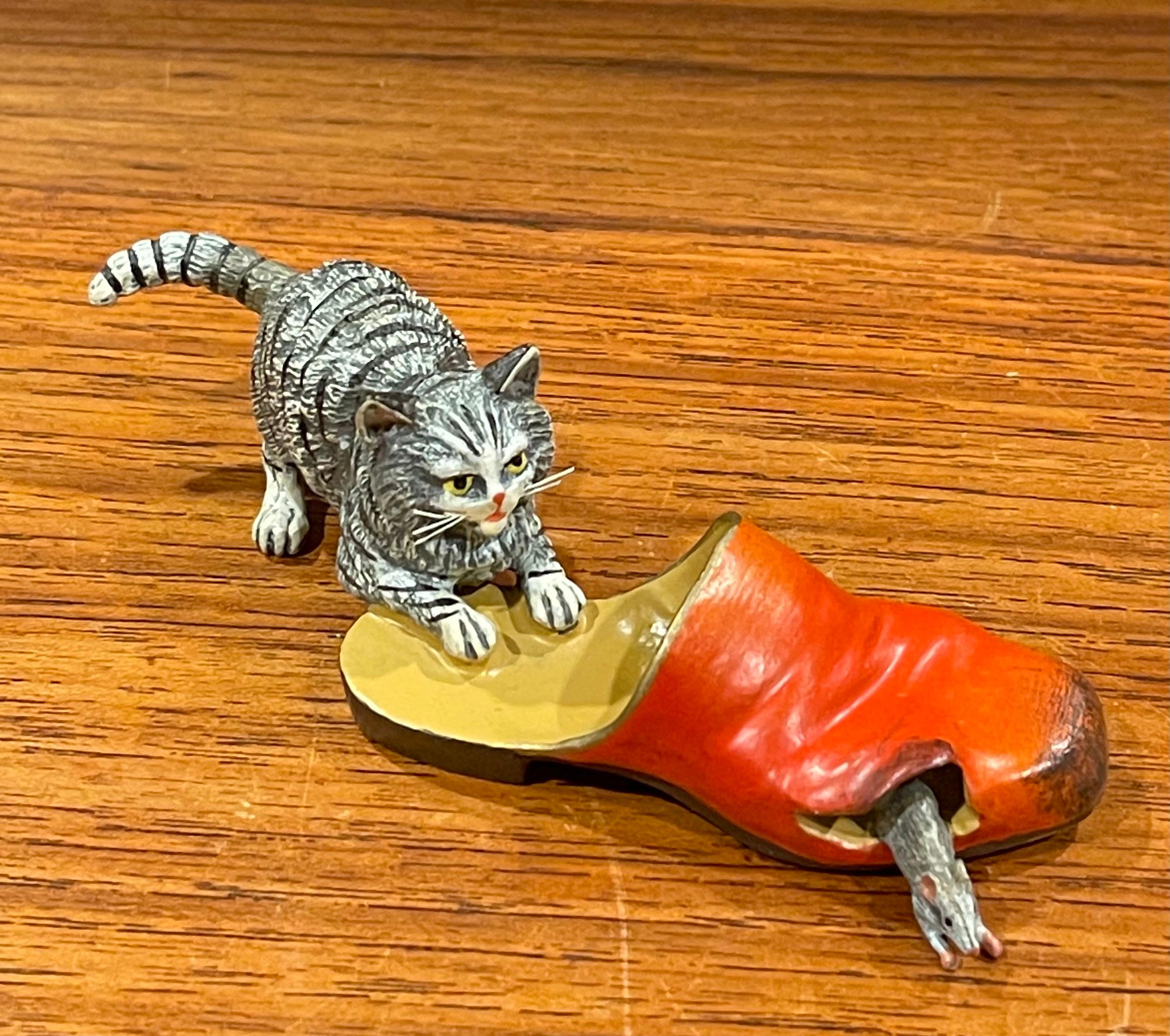 Austrian bronze hand painted miniature cat, mouse & shoe sculpture, circa 2000s. This piece has amazing detail and weight and is in excellent condition. The piece is individually cast from sand molds that are used only once, then sculpted and hand