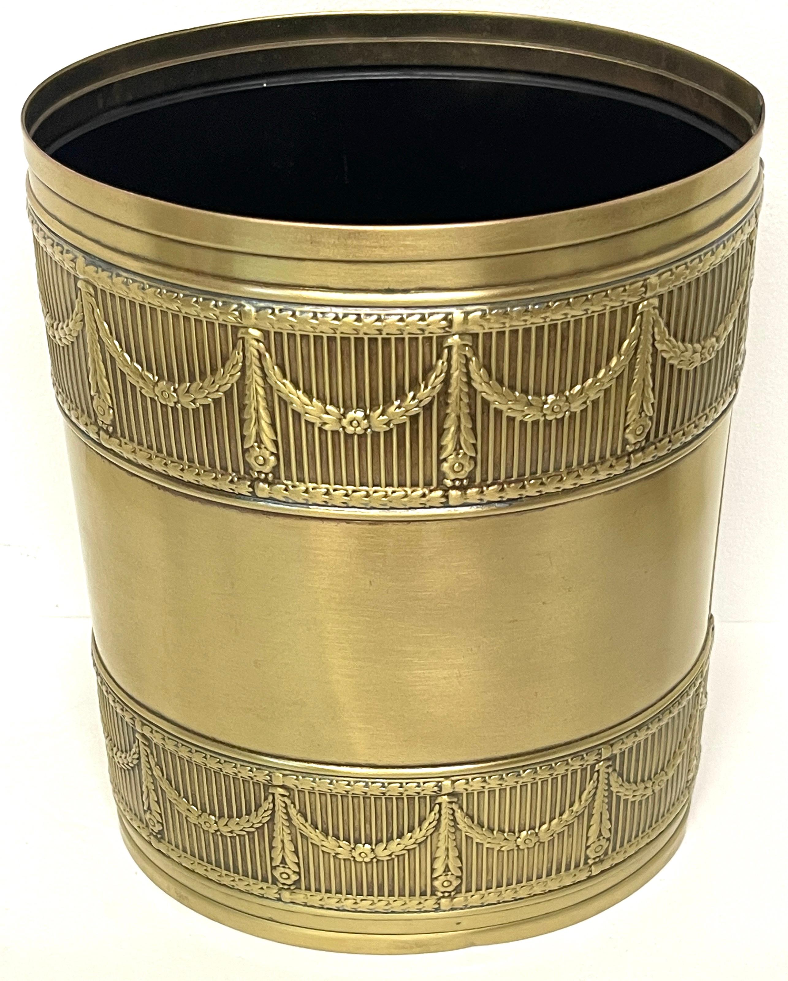 Austrian bronze & iron neoclassical trash can / wastepaper basket 
Austria, circa early 20th century
Of oval form with a continuous trellis, garland and flowerhead motif. Beautiful rich patina, cast and applied to a iron body. 

