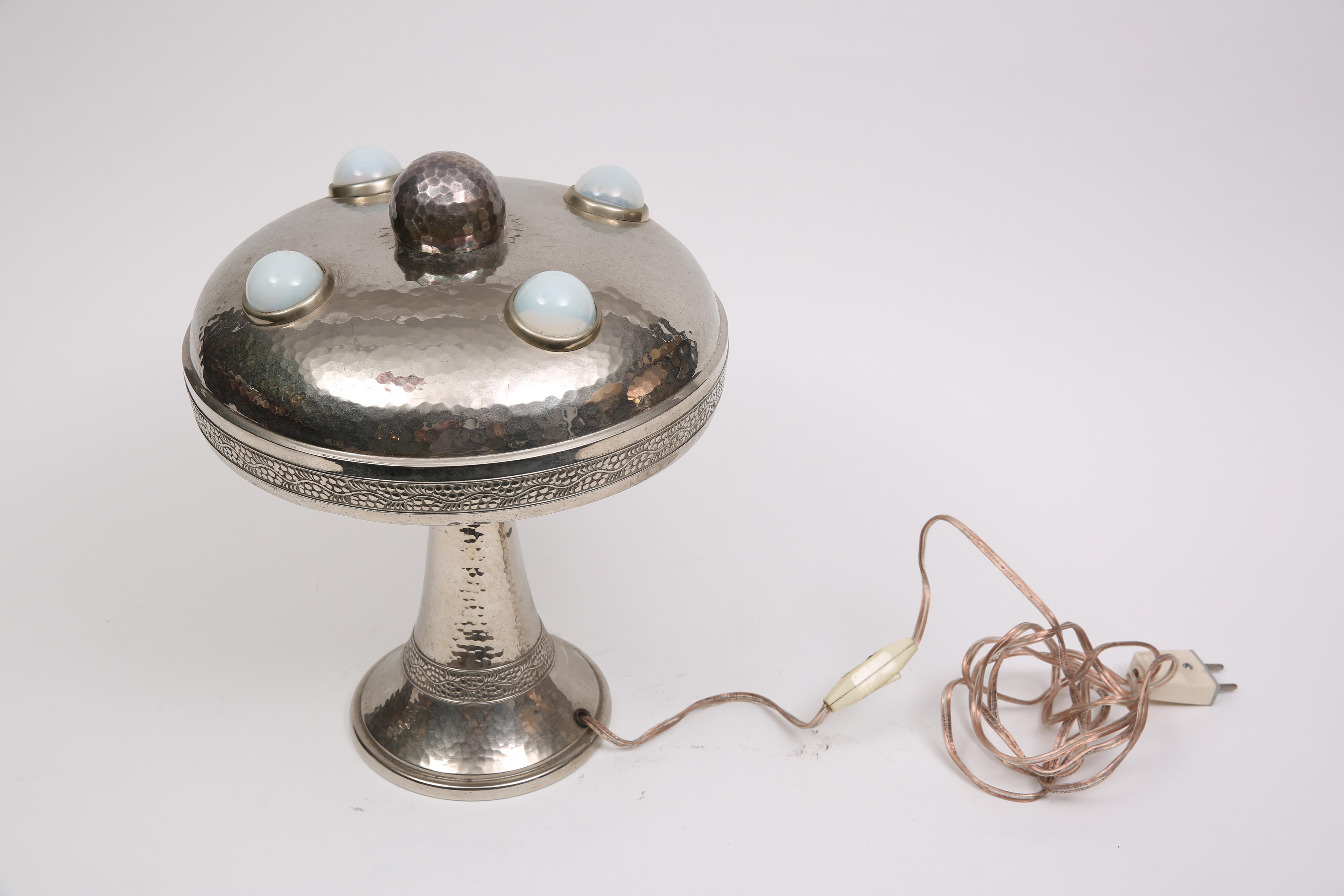 Austrian table lamp, made of silver-plated bronze with satin-finished glass.

Austria, CIRCA 1900.