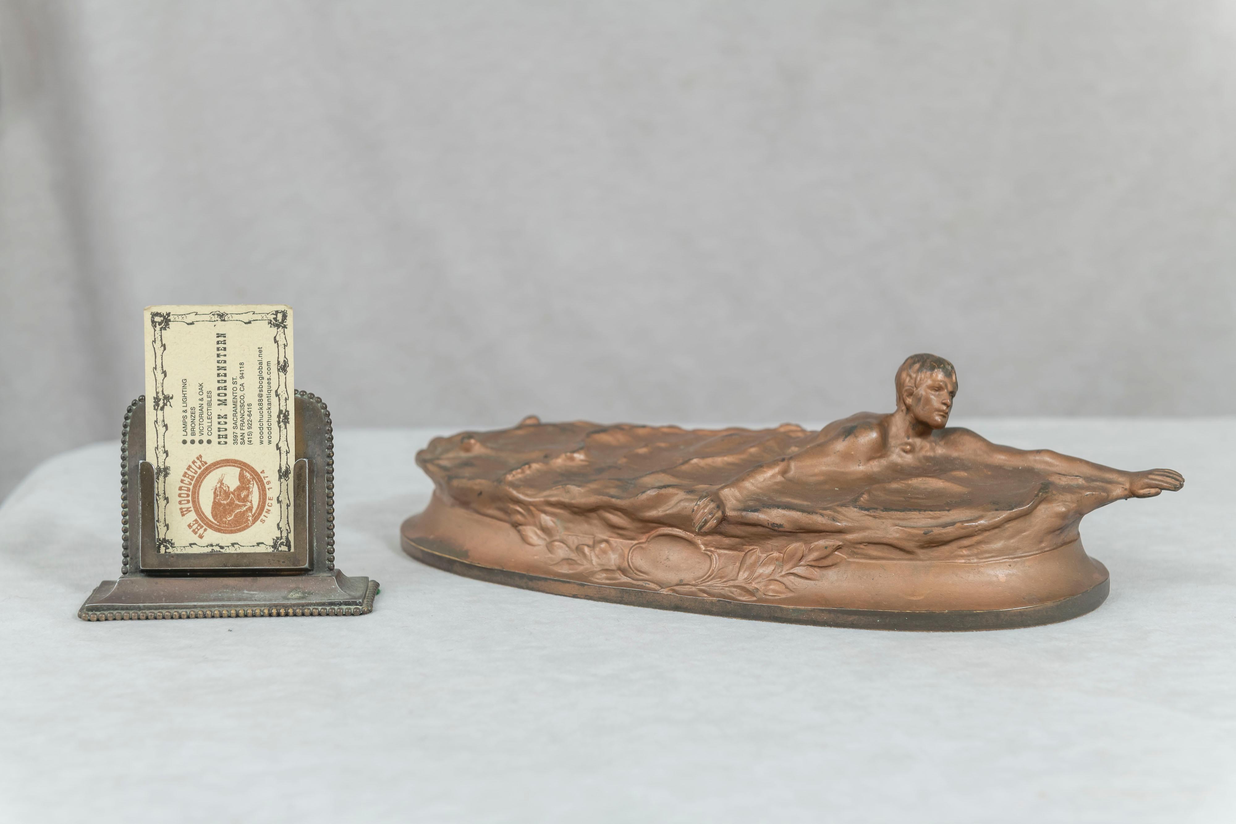 This very unusual bronze depicts a swimmer showing off his form. Artist signed 
