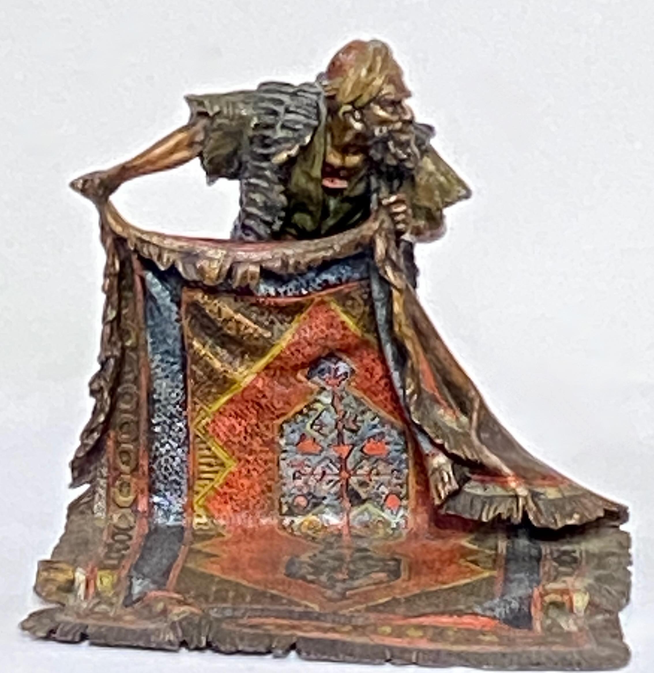 This exceptional large Orientalist style bronze is marked Bergman, one of early twentieth-century Vienna’s most famed producers. Crafted from cold-painted bronze, and depicts a rug merchant displaying his wares. The rug is richly detailed and the