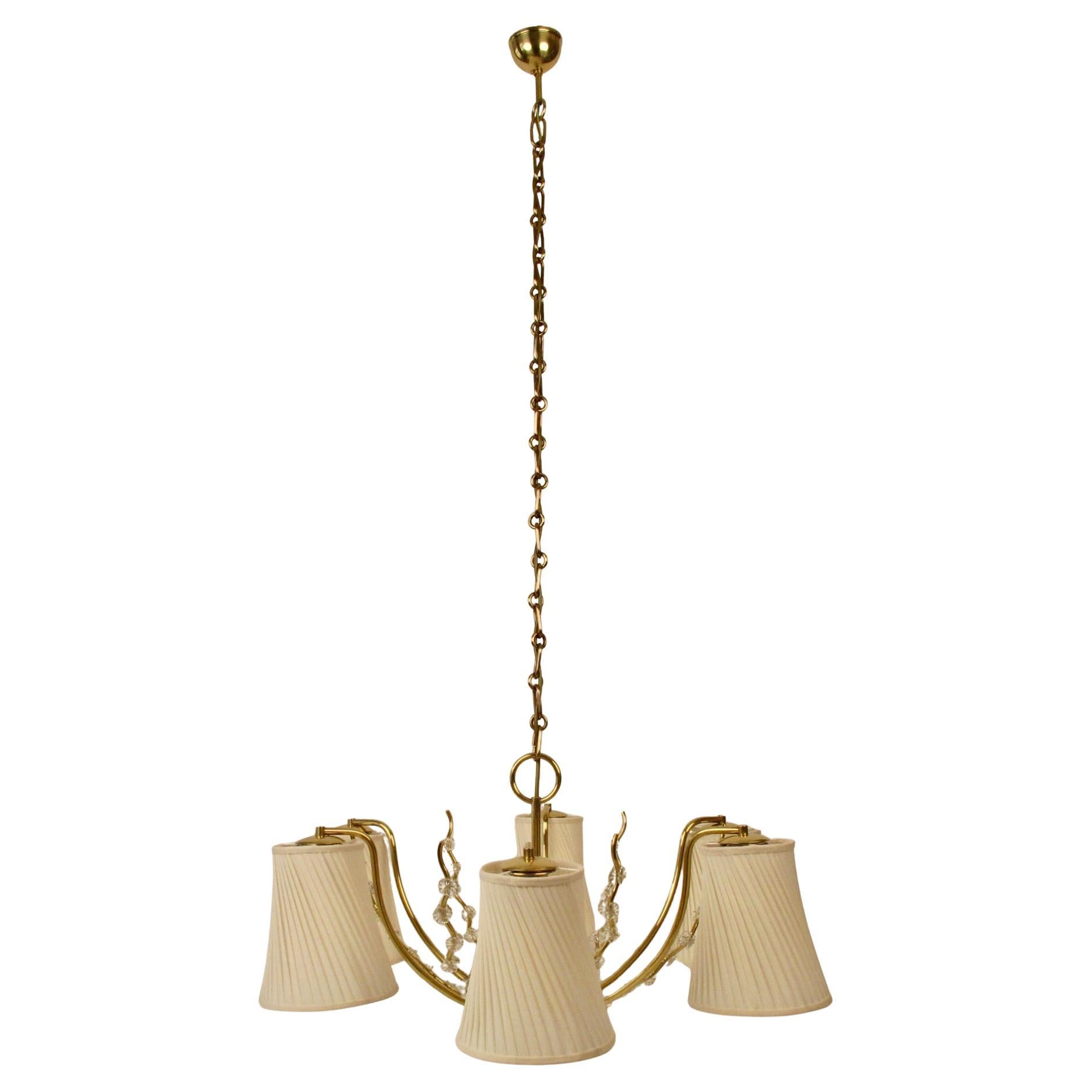 Elegant chandelier from Josef Frank produced in the 1950 ´s in Austria, probably by the company J.T. Kalmar.

The lamp has been completely restored, which includes rewiring, hand polishing and hand finishing with lacquer. The shades are made new,