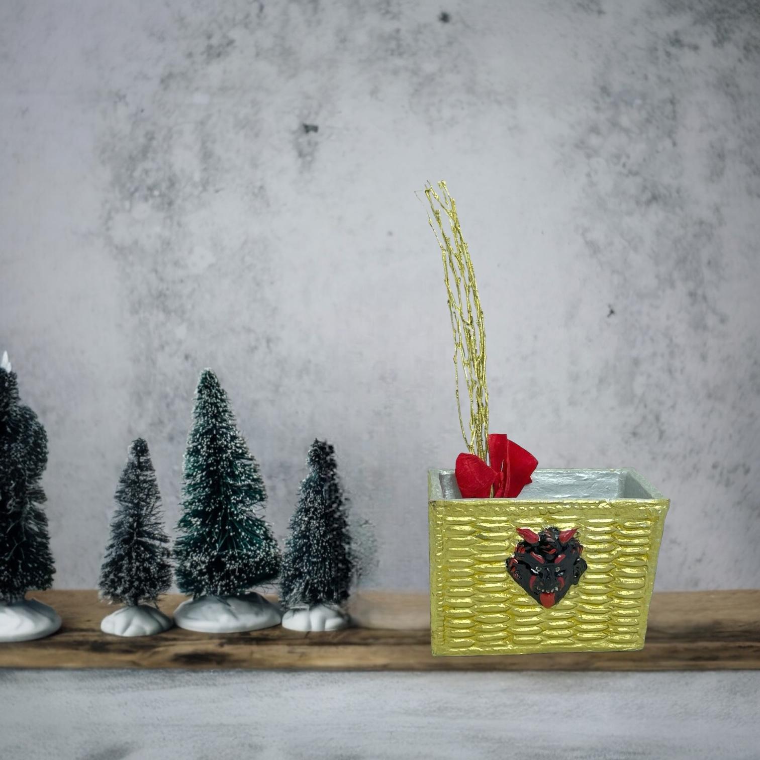 This unique Christmas Box from Austria is handmade and futures a famous Christmas character, The Krampus, Belsnickel's companion. The vintage piece dates from the 1940s or older and features intricate handwork and an antique finish. Given the rarity