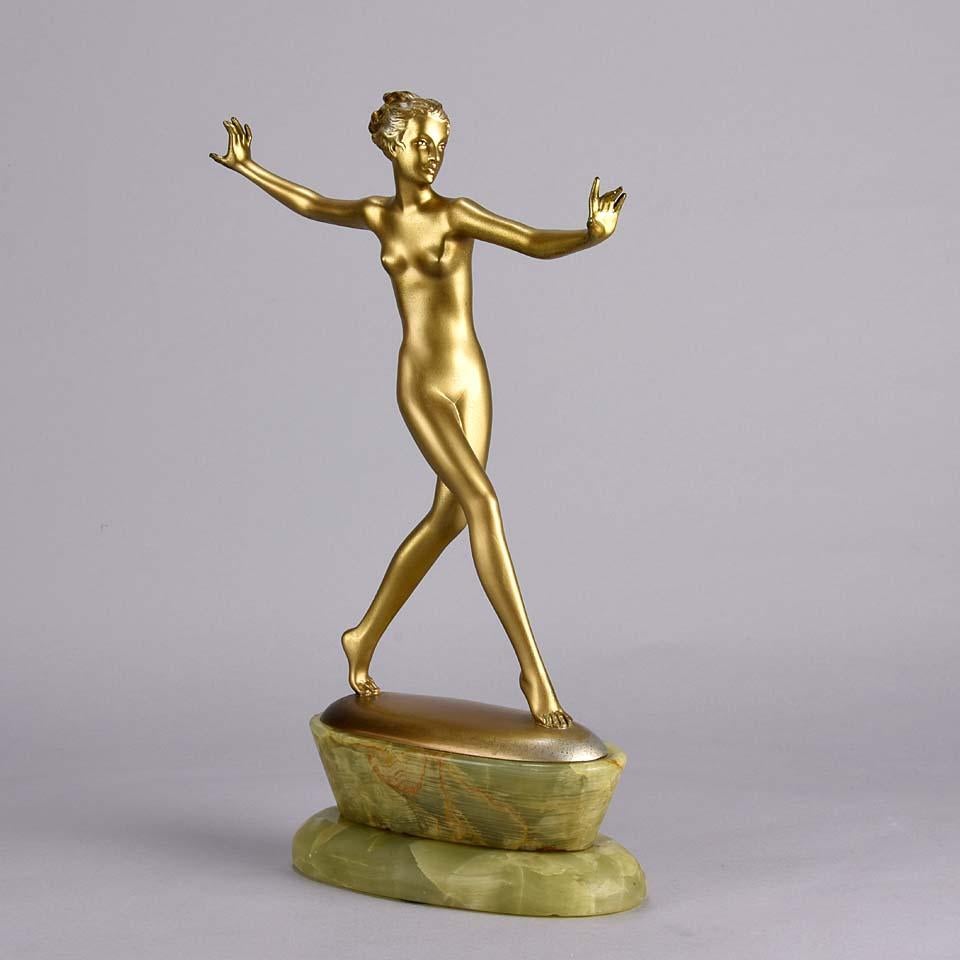 A very fine Art Deco cold painted bronze figure of an energetic dancer in striking pose with rich golden color and excellent hand finished detail, raised on a Brazilian green onyx base and signed Lorenzl.


Josef Lorenzl, Austrian, 1892-1950,