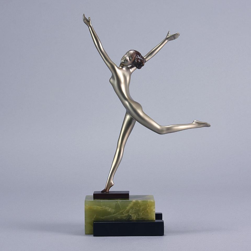 An excellent early 20th century Austrian Art Deco cold painted bronze figure of a beautiful young dancer in a stretched stylized pose, with very fine color and detail, raised on a stepped black marble and onyx base, signed Lorenzl


Josef