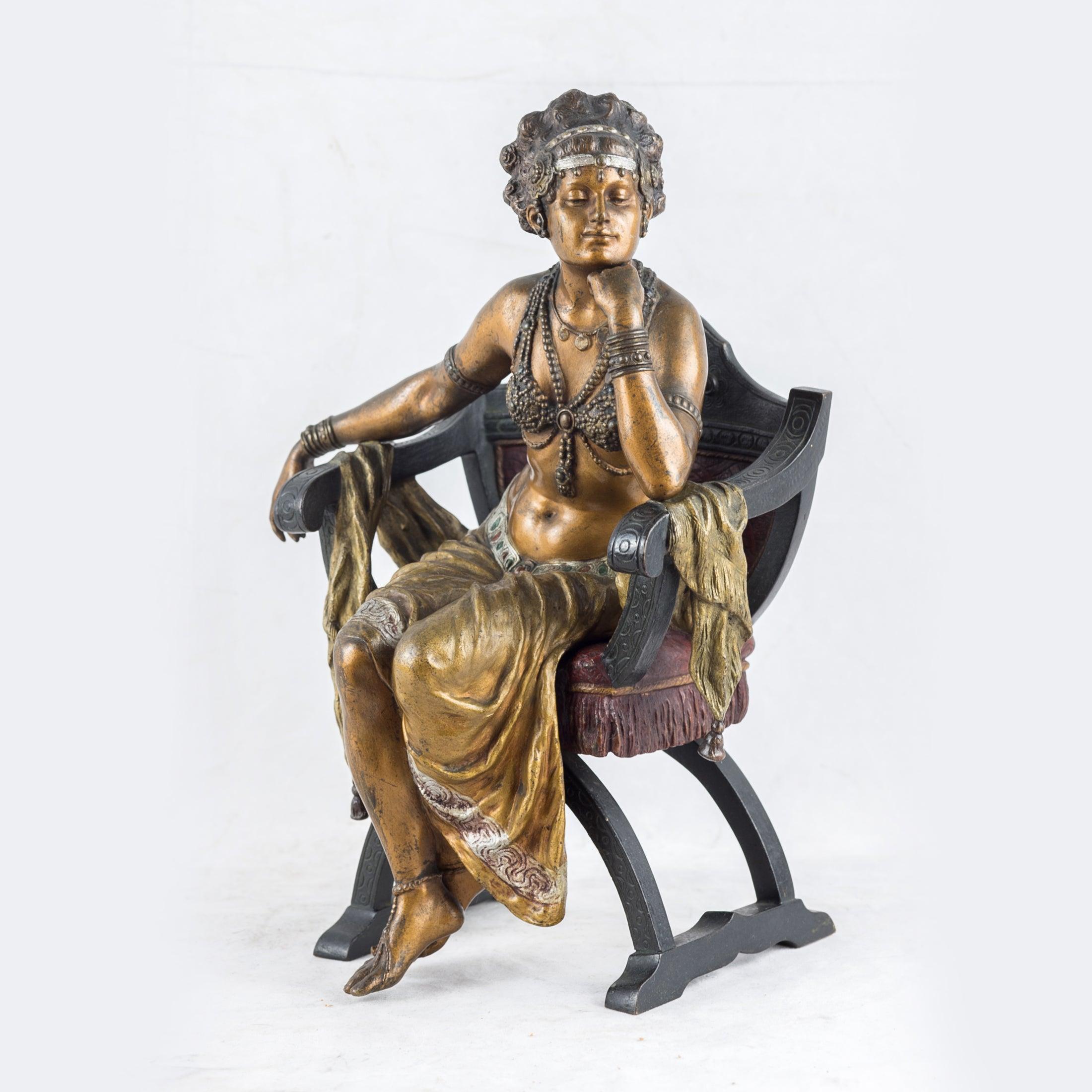 Franz Bergman
Austrian, (1861-1936)

A fine Austrian cold-painted bronze figure of a seated exotic dancer. The exotic dancer in an exotic costume, cast seated on a curule chair with her chin resting on her hand, Inscribed to reverse with 