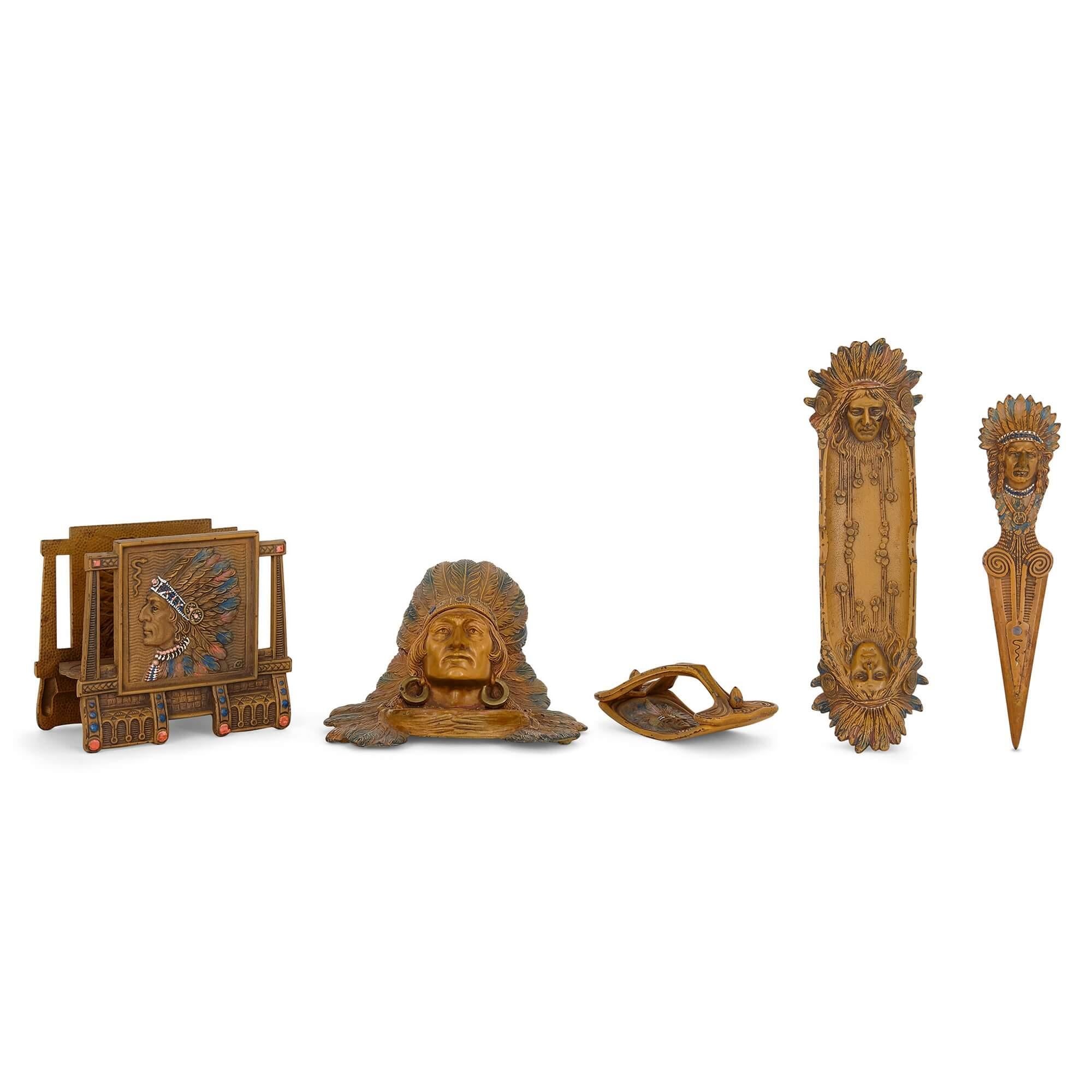 Austrian cold-painted bronze desk set of American interest.
Austrian, c. 1910
Letter holder: height 14.5cm, width 16.5cm, depth 9cm.
Inkstand: height 12cm, width 19cm, depth 17cm

This unusual desk set is crafted from cold-painted bronze in the