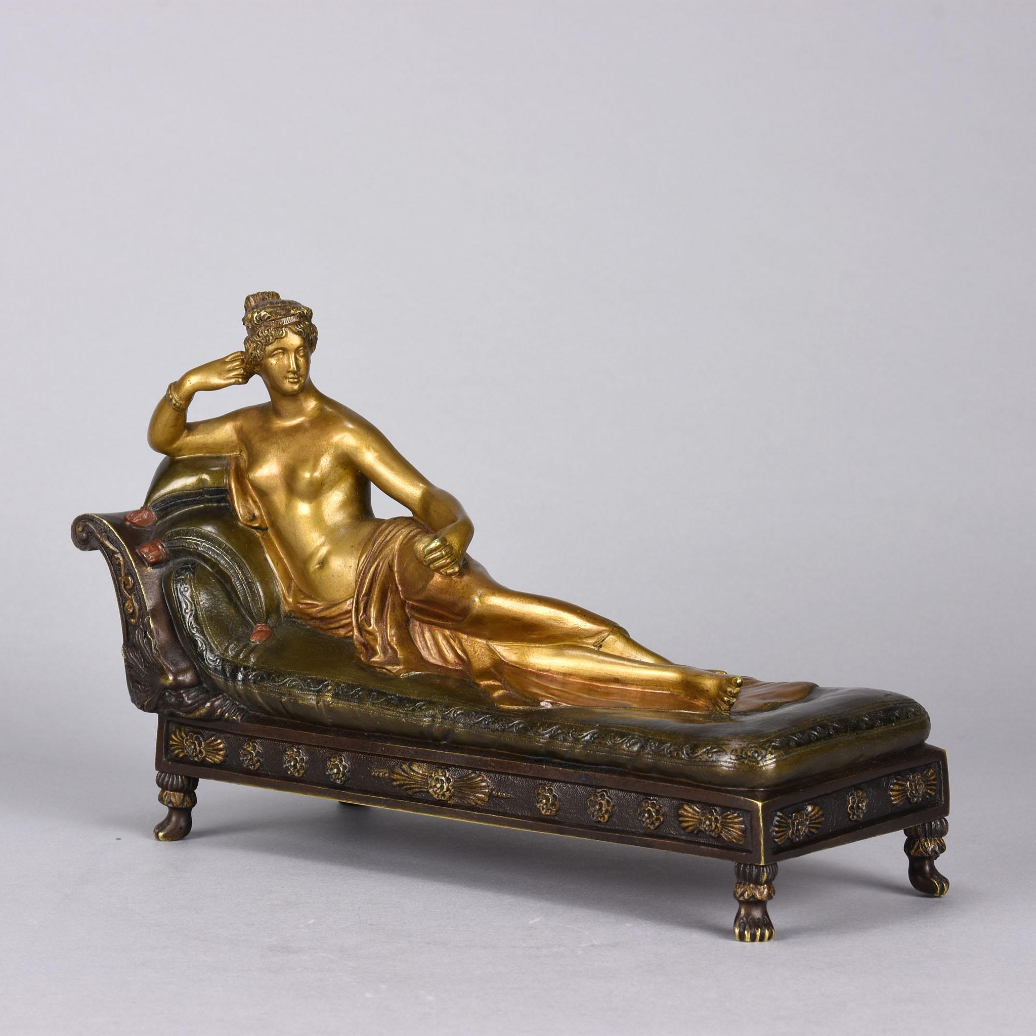 An excellent early 20th century cold painted Austrian bronze study of the famous first Sovereign Duchess of Italy Pauline Borghese Bonaparte reclining on a daybed originally sculpted in marble by Antonio Canova in 1805. The bronze exhibiting