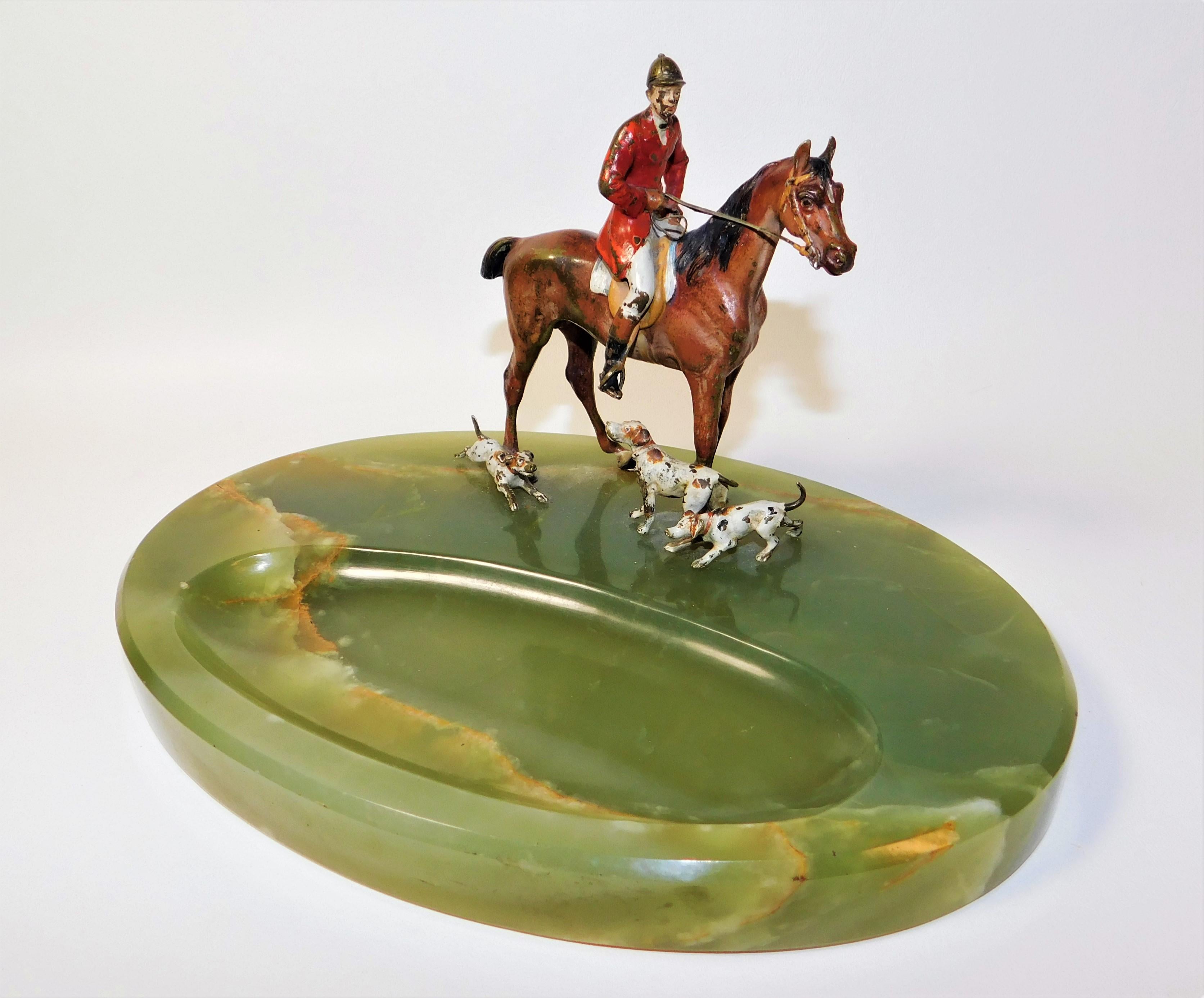 Beautiful desk accessory for the fox hunter. Austrian/Vienna cold painted bronze fox hunter on his horse with his three hounds. Onyx base with letter opener or pen well/tray in excellent condition, felt on bottom. Some paint loss on the rider, horse