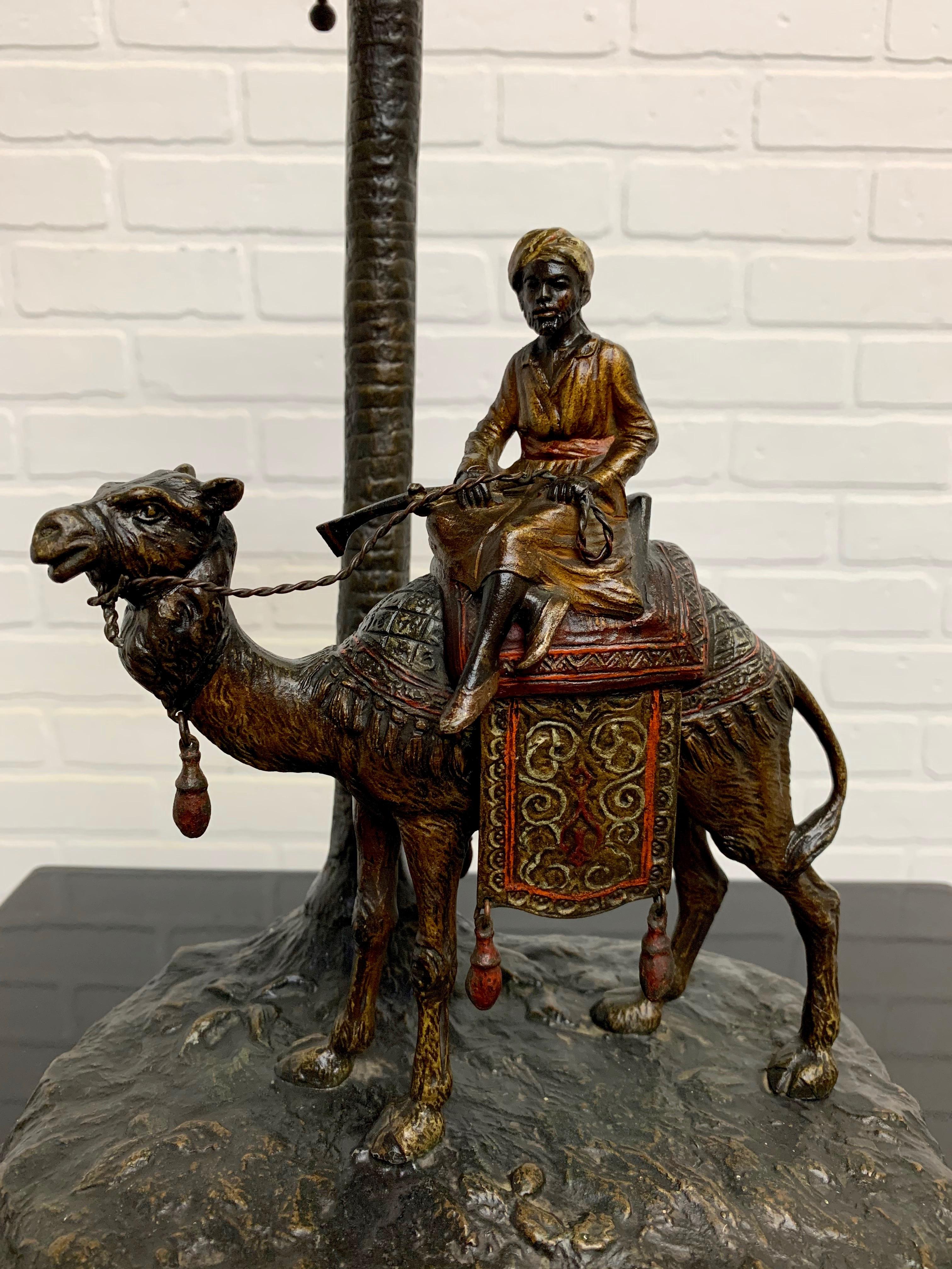Viennese cold painted bronze orientalist lamp attributed to Bergman of a middle eastern man riding a camel. 
Signed Austria.