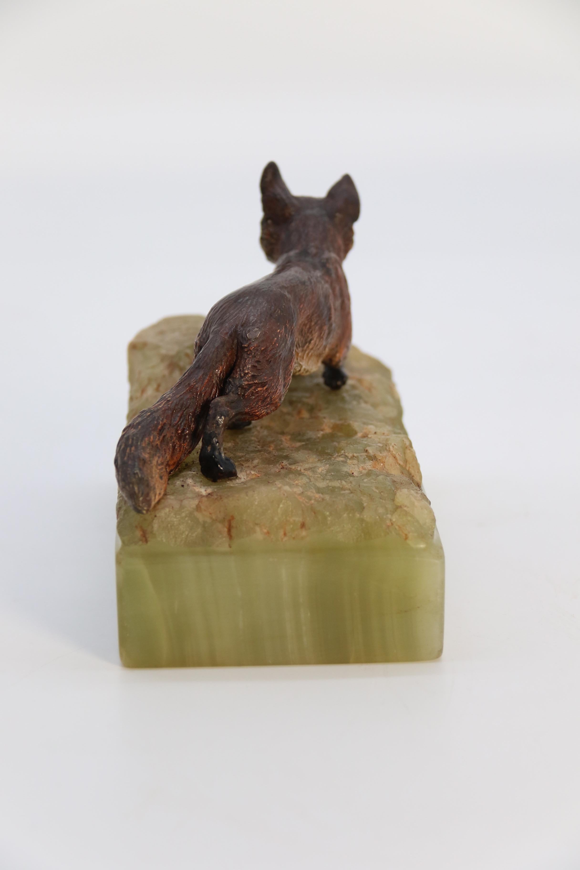Bronze  Austrian cold painted bronze study of a fox mounted on a green onyx base c 1920 For Sale