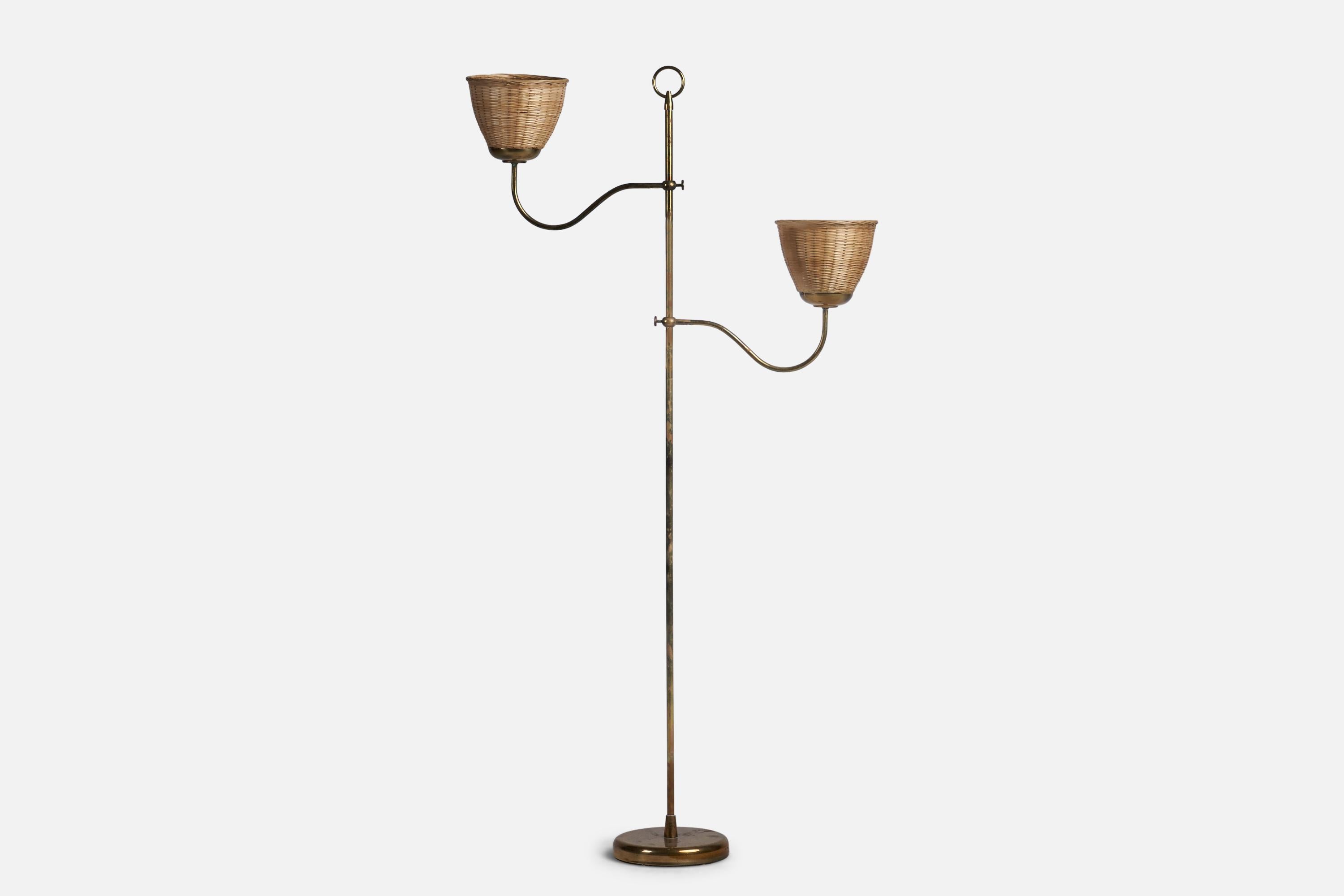 A brass and rattan floor lamp designed and produced in Austria, c. 1940s.

Overall Dimensions (inches): 51.75” H x 28” W x 7.5” D
Bulb Specifications: E-26 Bulb
Number of Sockets: 2
All lighting will be converted for US usage. We are unable to