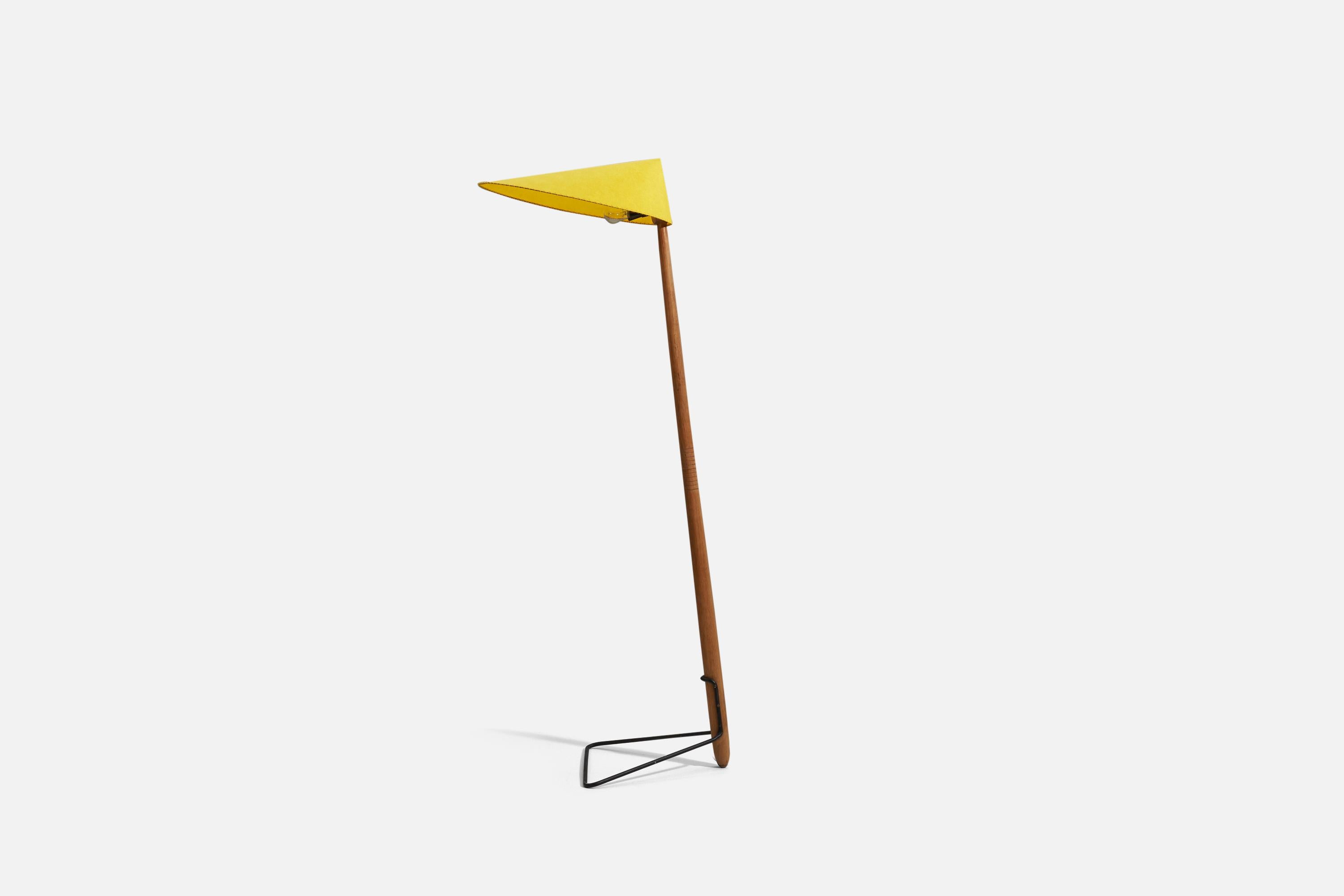 A floor lamp designed and produced in Austria, 1950s-1960s. Composed of teak, black-lacquered metal. The original lampshade has recently been recovered.