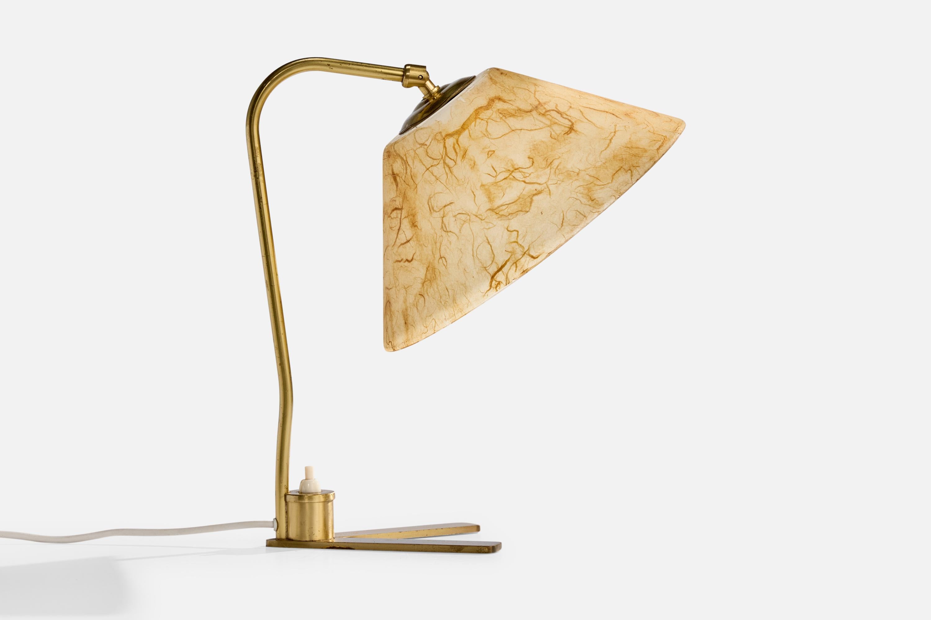 An adjustable brass and beige resin table lamp designed and produced in Austria, c. 1950s.

The brass neck presents with light oxidation.

Dimensions of Lamp with Shade (inches): 13.0