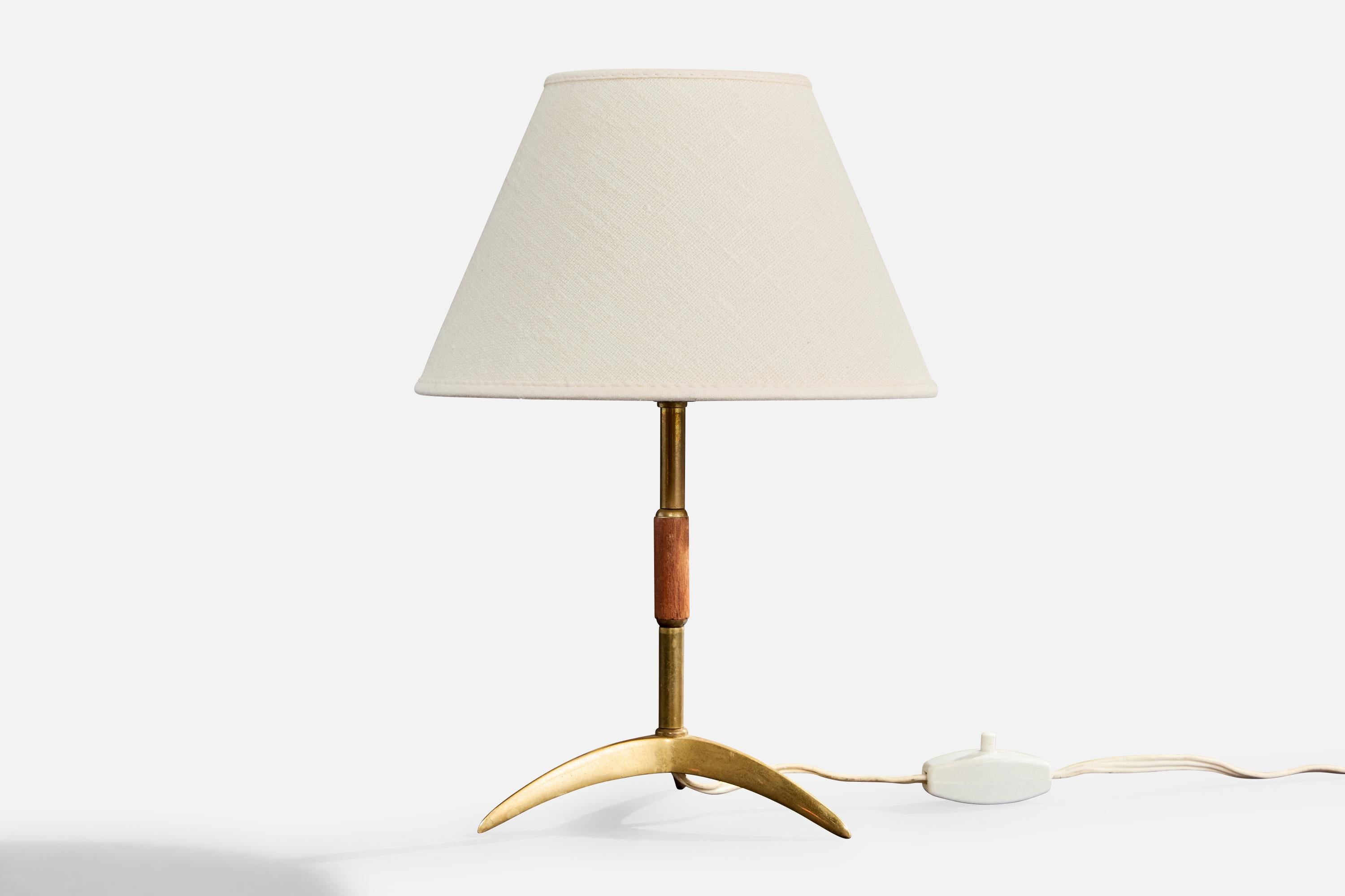 A brass and teak table lamp likely designed and produced in Austria, c. 1950s.

Dimensions of Lamp (inches): 8.5