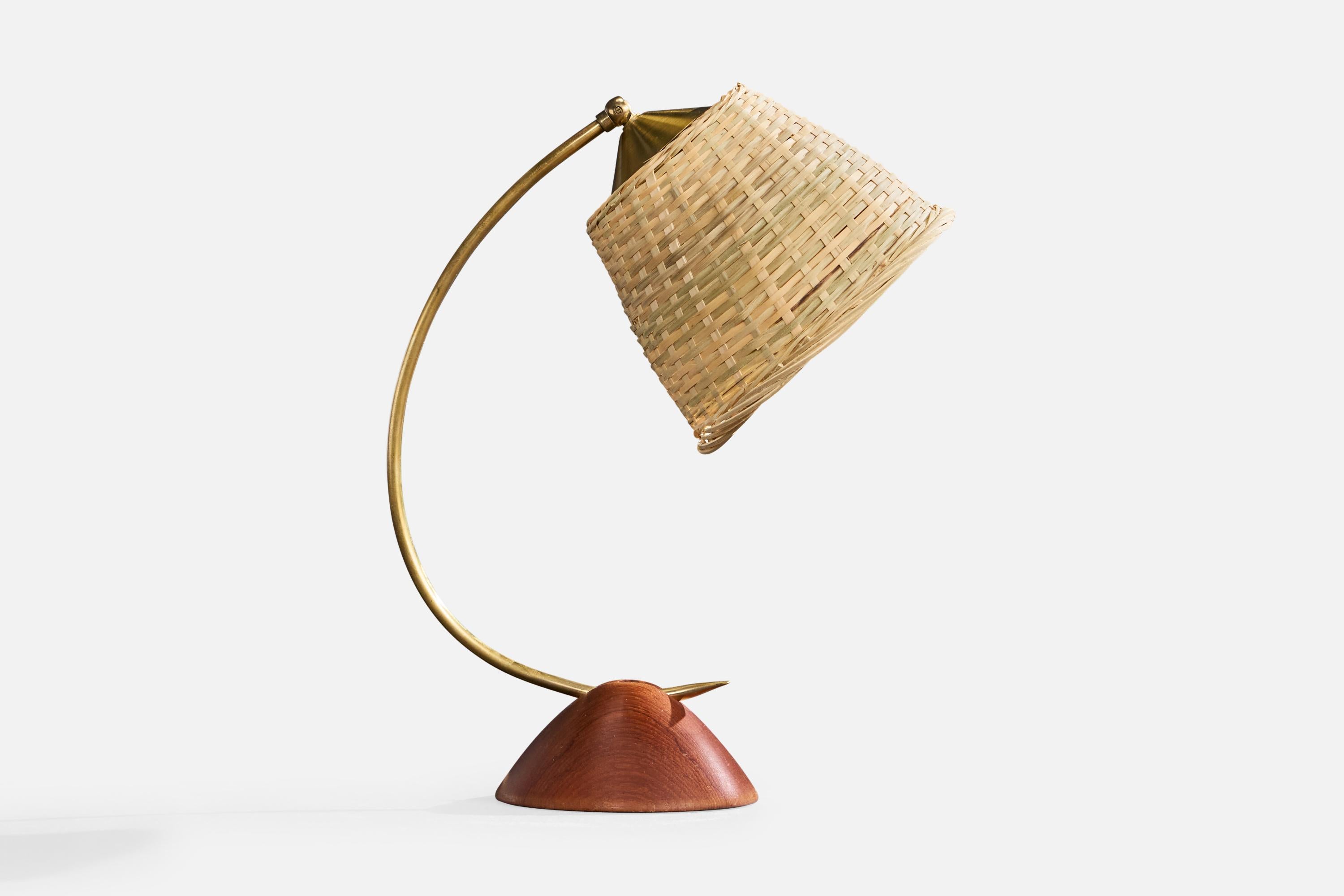 An adjustable brass, teak and rattan table lamp likely designed and produced in Austria, c. 1950s.

Dimensions of Lamp (inches): 14.0