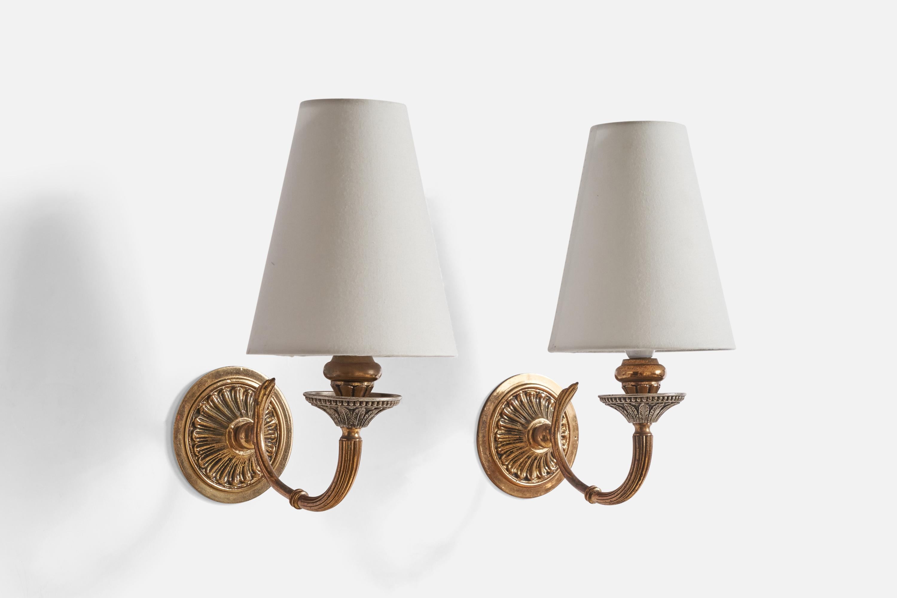A pair of brass and metal wall lights designed and produced in Austria, c. 1940s.

Overall Dimensions (inches): 11” H x 5.5” W x 8.25”  D
Back Plate Dimensions (inches): 3.75”  H x 3.75”  W x .25” D
Bulb Specifications: E-14 Bulb
Number of Sockets:
