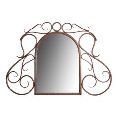 Designer austriaco, Specchio da parete, legno di bengala, Austria, circa 1900