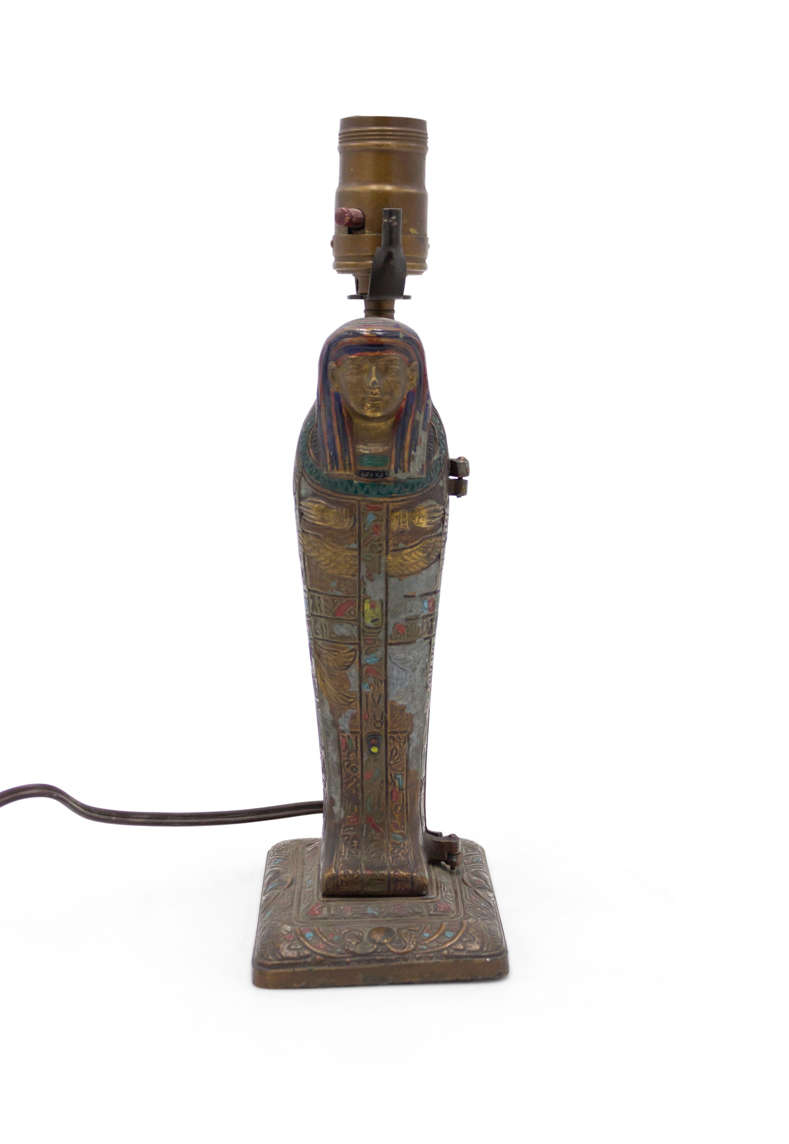 Austrian Egyptian revival style metamorphic cold-painted bronze sarcophagus shaped table lamp in the style of Franz Bergman with a bronze doré female figure inside base. (Attributed to LOUIS V. ARONSON circa 1923).