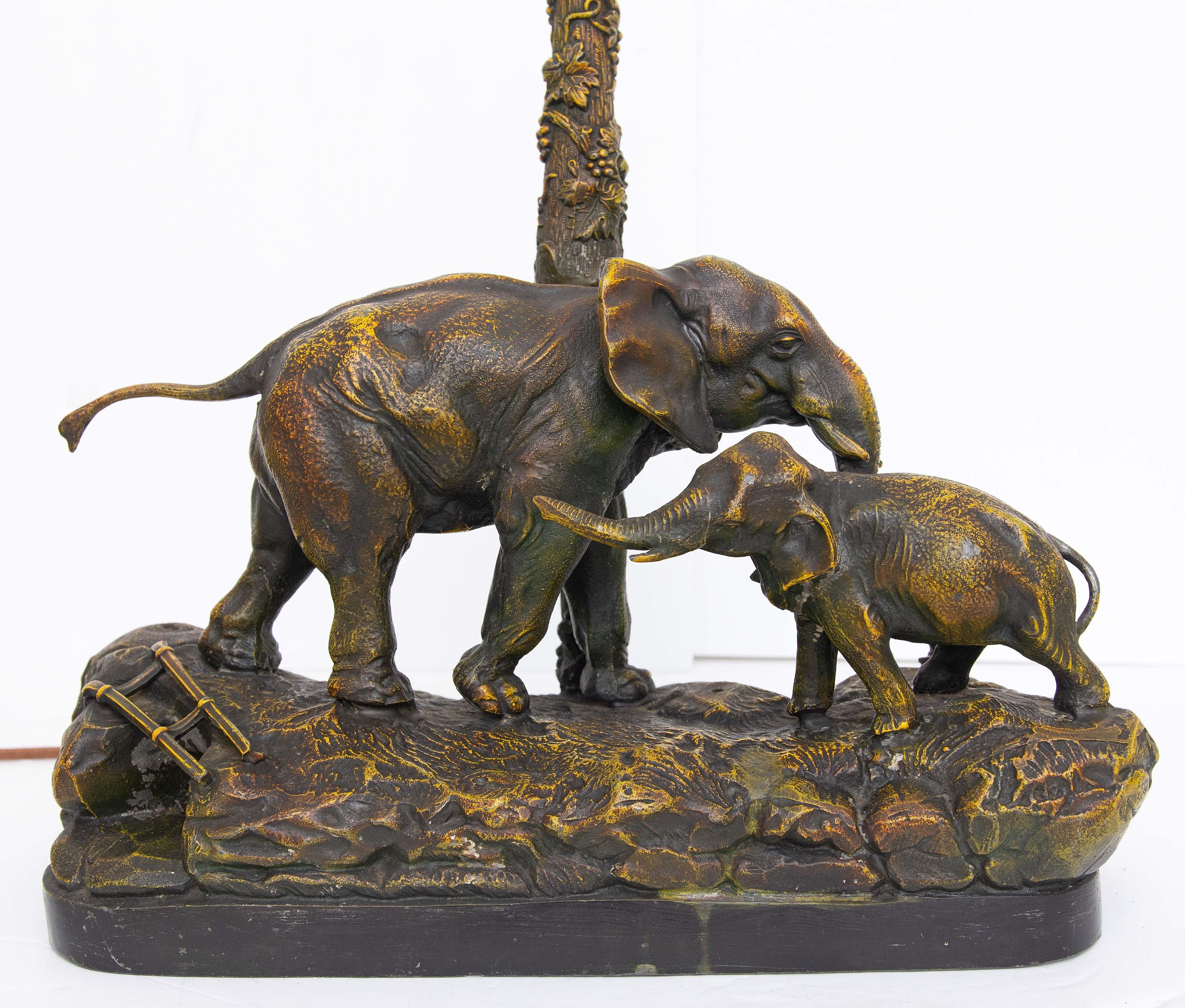 Exotic painted spelter lamp with mother elephant and her calf. Austrian. Early 20th century.