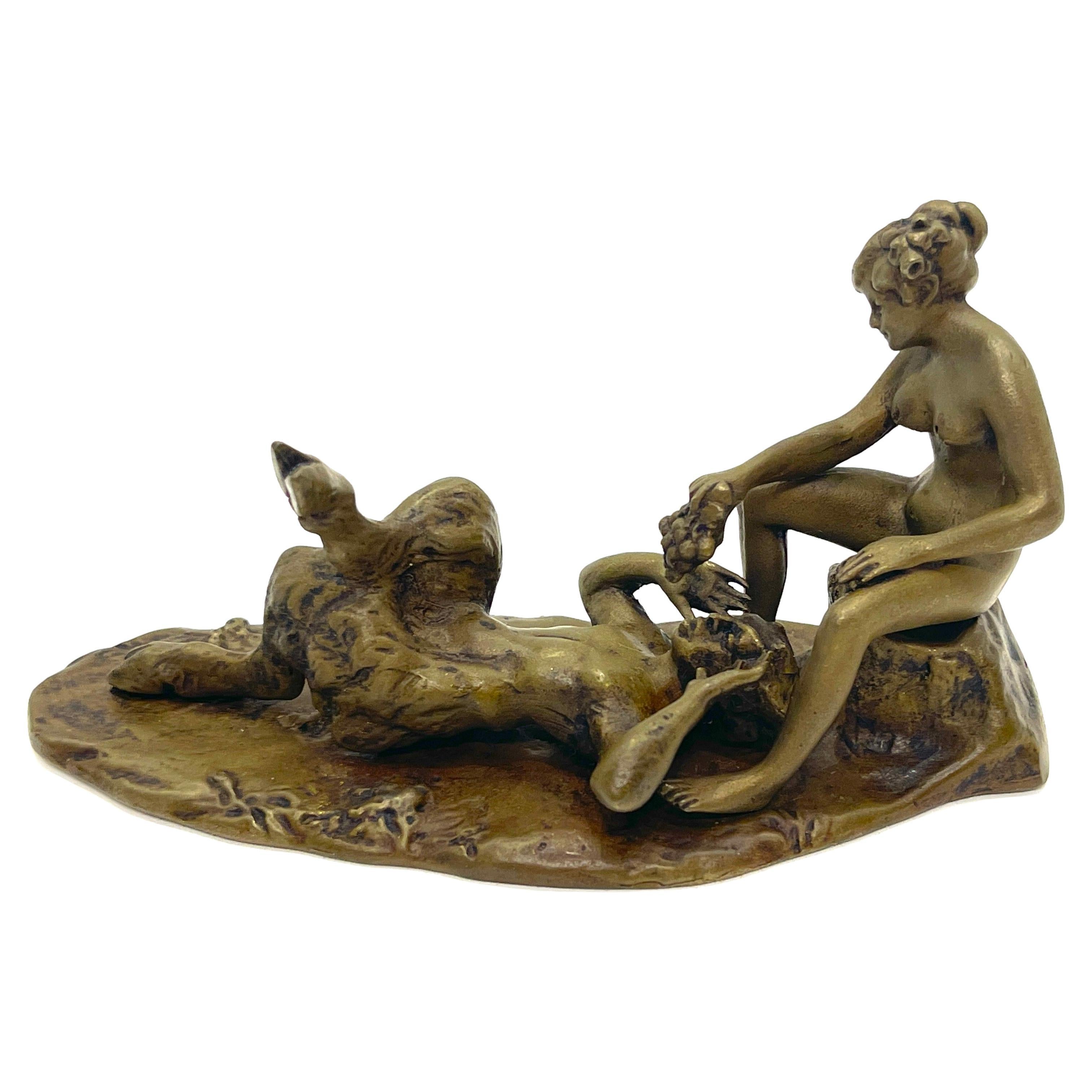 Austrian Erotic Bronze Nymph & Satyr, Style of Bergman 
Austria, circa 1900s

A well executed two piece bronze, that presents the naked female figure feeding the reclining satyr grapes. The adult option to lifting the nymph and setting her on