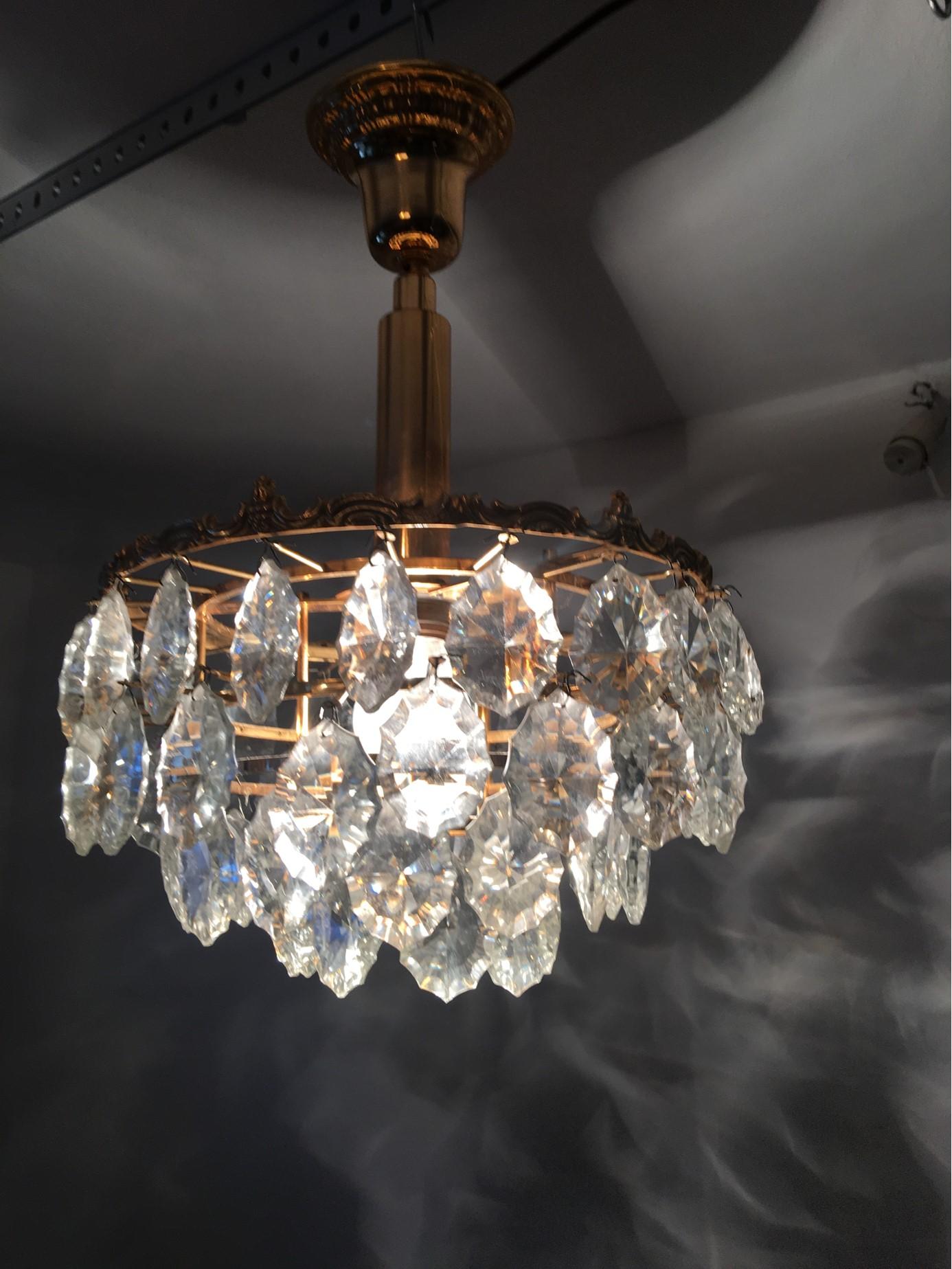 Very lovely ceiling light fixture. Made of golden plated copper in the style of the famous Austrian manufacturer Bakalowits. We were also able to obtain four extra Chrystal which will be included as replacement parts if ever needed. The light