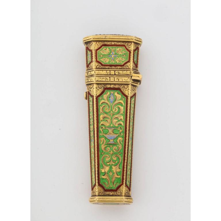 An Austrian gold, enamel, and Jewel-set necessaire etui box case, 19th century  Fantastic quality enamel.   Chased and enameled with urns of foliage in green and red enamel, the top with pavé rubies, fitted with four gold implements.   Excellent