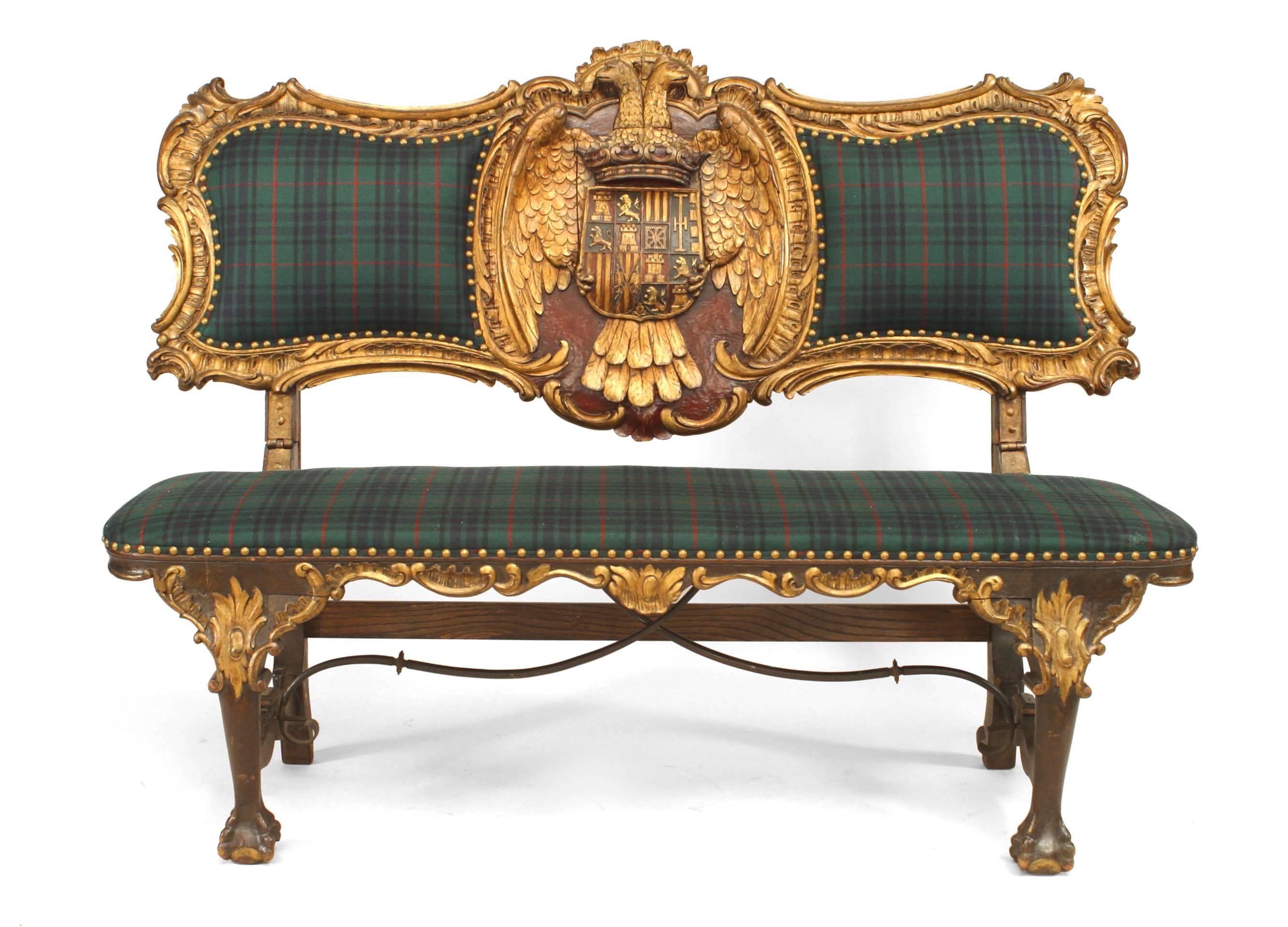 Austrian Hungarian (19th century) walnut and gilt trimmed loveseat with a back featuring a double eagle head crest between two upholstered panels and wrought iron stretcher.
  