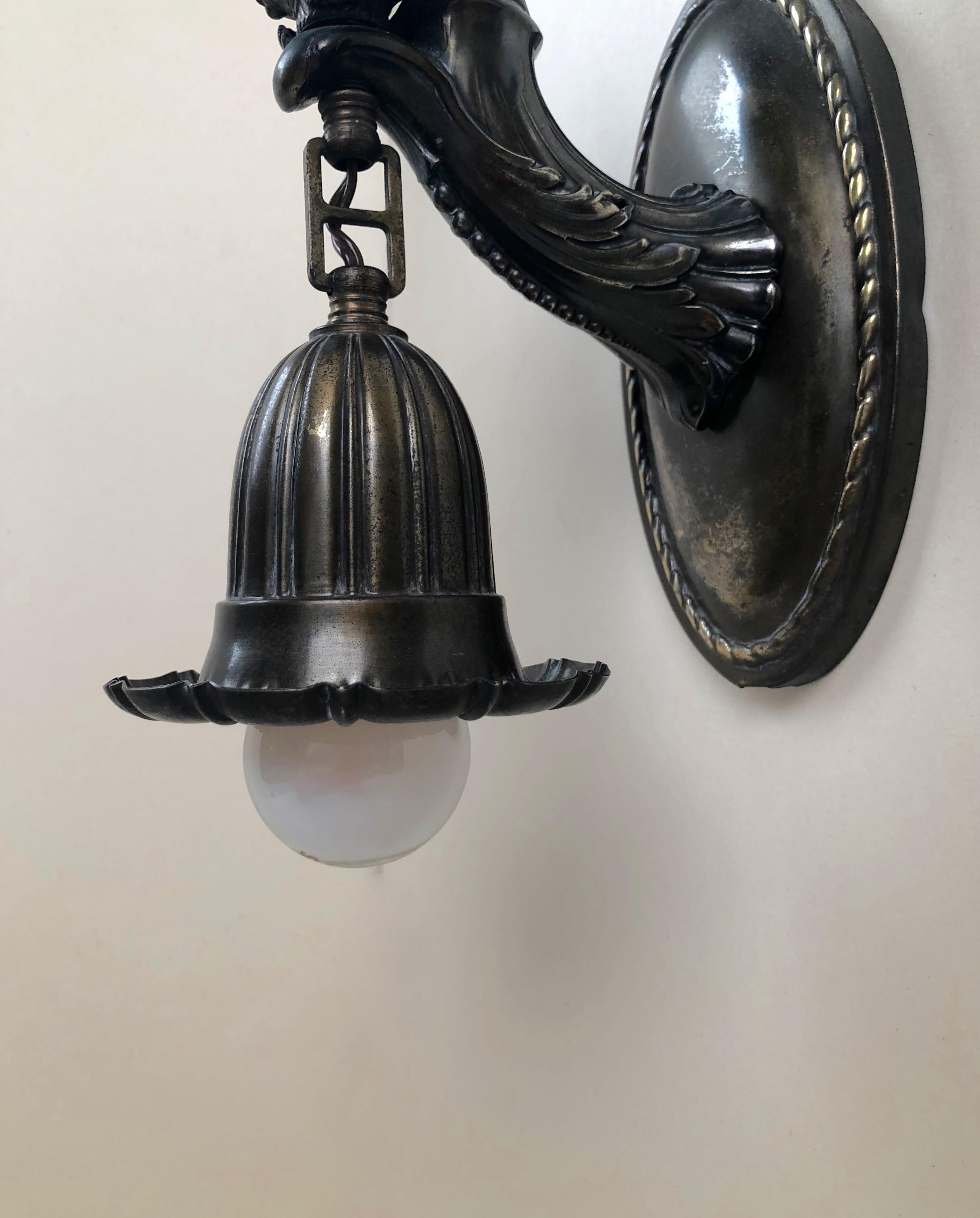 Early 20th Century Austrian Jugendstil Bronze Wall Sconce with a Torso of a Women Holding a Bouquet