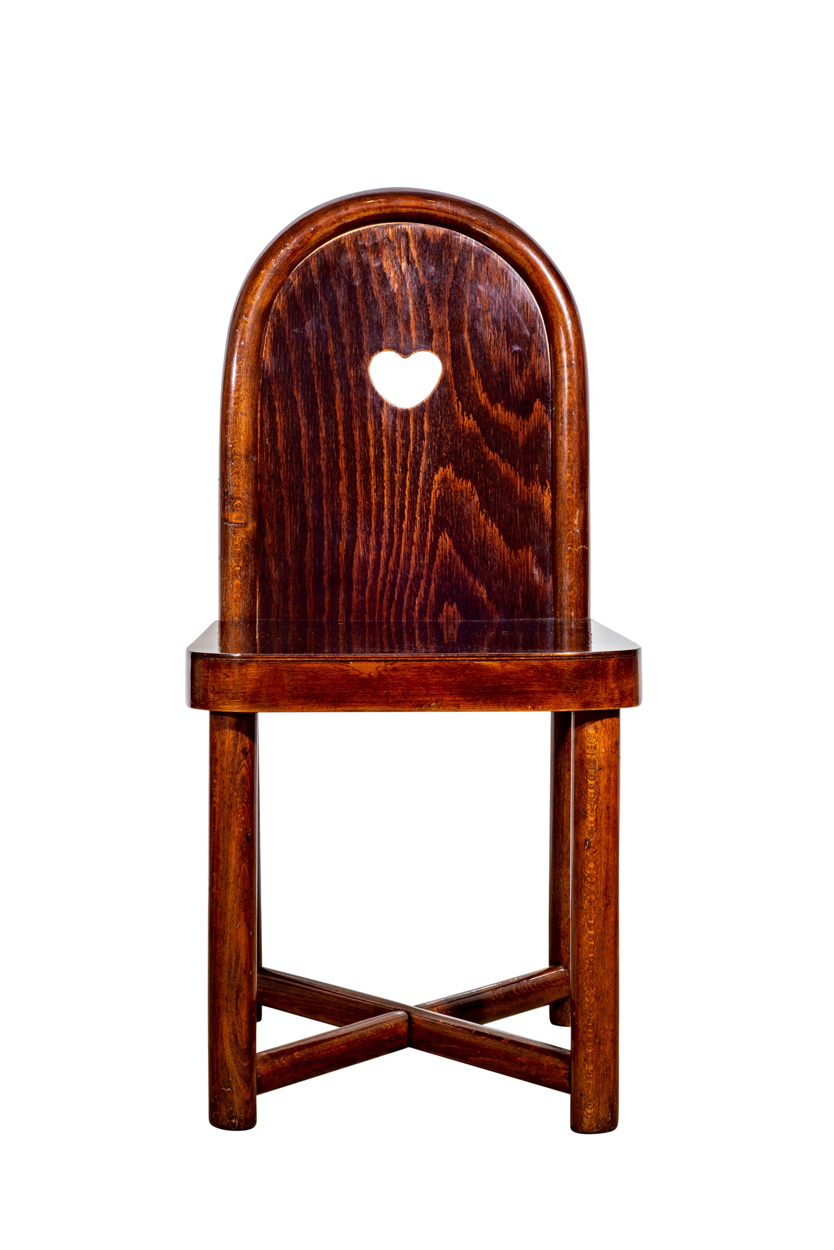 Austrian Jugendstil children's chair bent beechwood mahogany stained designed by Otto Prutscher manufactured by Gebrüder Thonet

Otto Prutscher, trained carpenter and student at the Vienna Kunstgewerbeschule under Josef Hoffmann, was an important