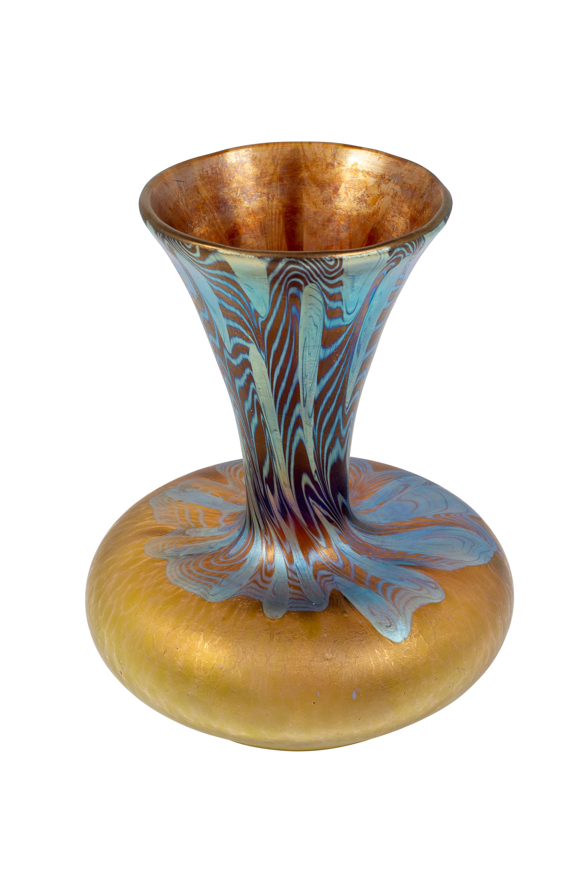 Austrian Jugendstil Glass Vase Johann Loetz Witwe with Argus decoration PG 2/351 ca. 1902

The “Argus” decoration is one of the most popular variants in the family of Phenomen Genres and was created in 1902. With its inserted eyes of silver oxide