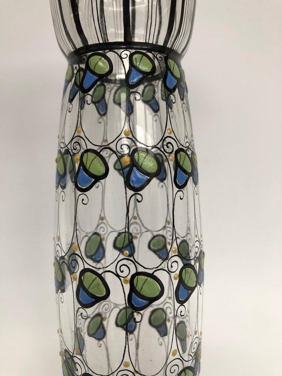 Glass vase with enameled decor small bells blue and green. 
1910 Wiener Werkstätte 
Austrian vase with polychrome Enameled decoration.
Probably a creation of Joseph Hoffmann (1870-1956) co-founder of the Wiener Werkstätte.
In very good