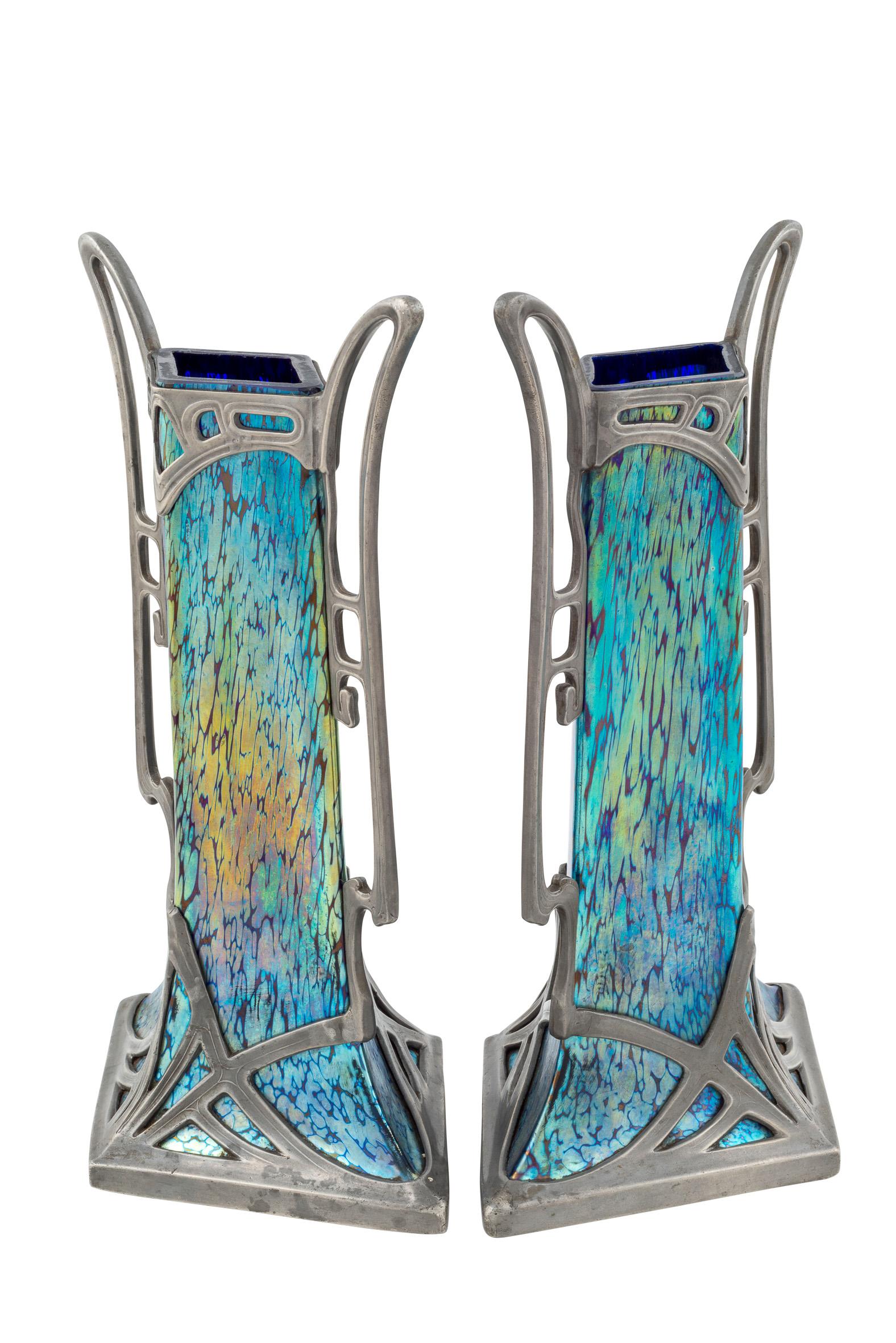 Austrian Jugendstil pair of glass vases blue with Tin Mounting from Arndt & Marcus Berlin circa 1902 Loetz Cobalt Papillon Decoration 

This pair of vases with the Cobalt Papillon decoration is an outstanding example of the incredible range of