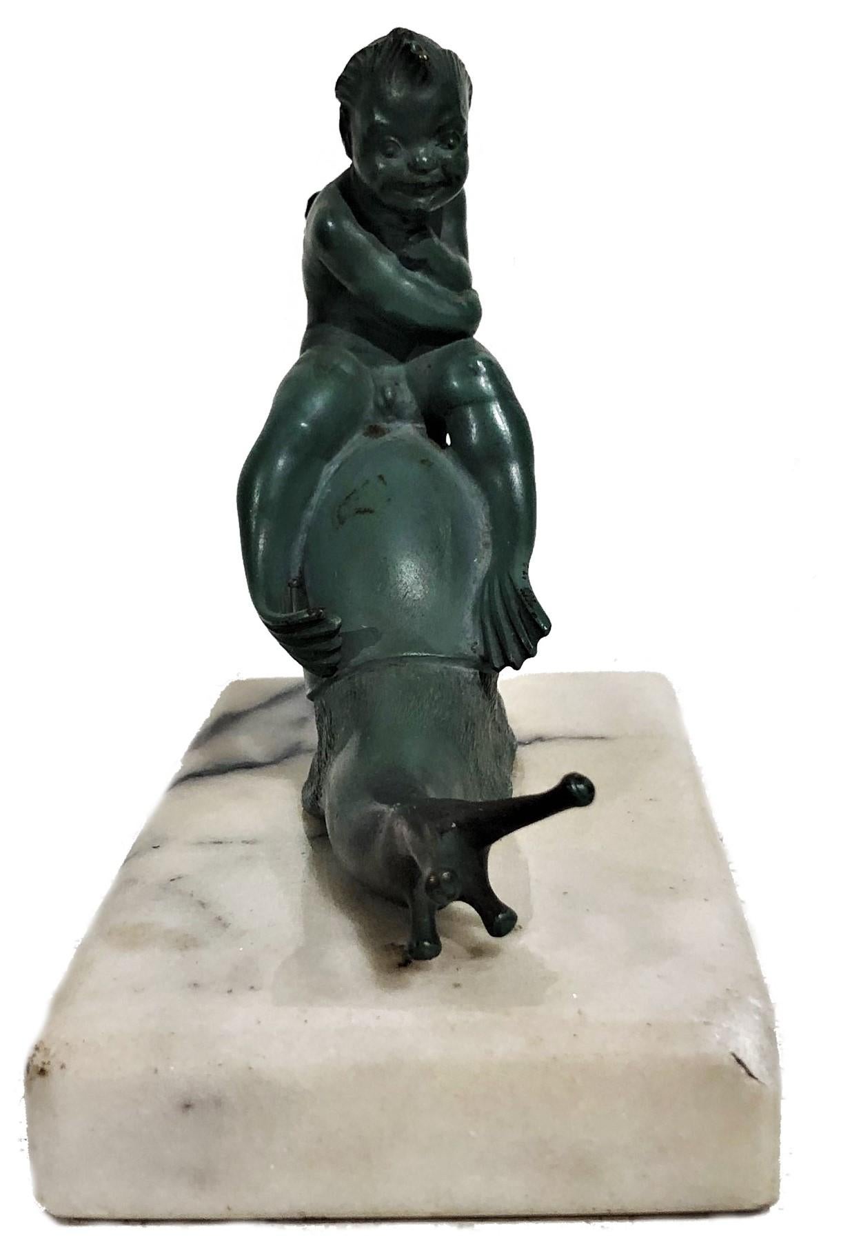 ABOUT
This elegant Austrian Jugenstil sculptural desk paperweight depicts some fantastic half-human creature from the underwater world, riding a snail. Signed C. Fiala, dark-green cold-painted bronze, Vienna, ca. 1910. Original marble base (a few