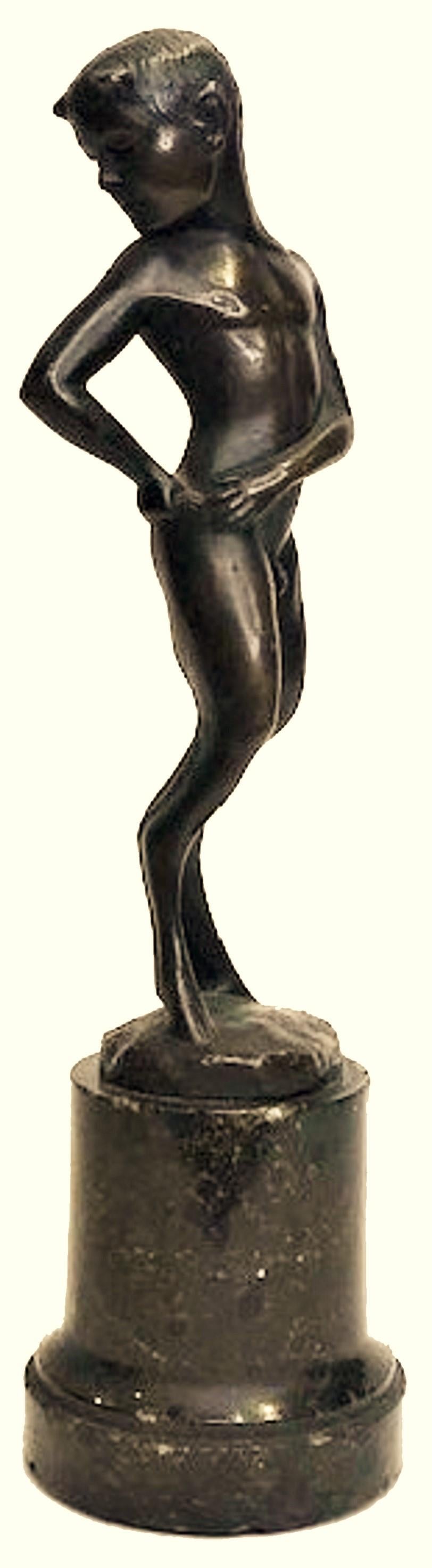 Probably Austrian, this lovely Jugenstil desk-sized black-patinated bronze figurine on its original marble pedestal depicts a fawn youth, checking the size of his tail to see how much he has grown and matured.