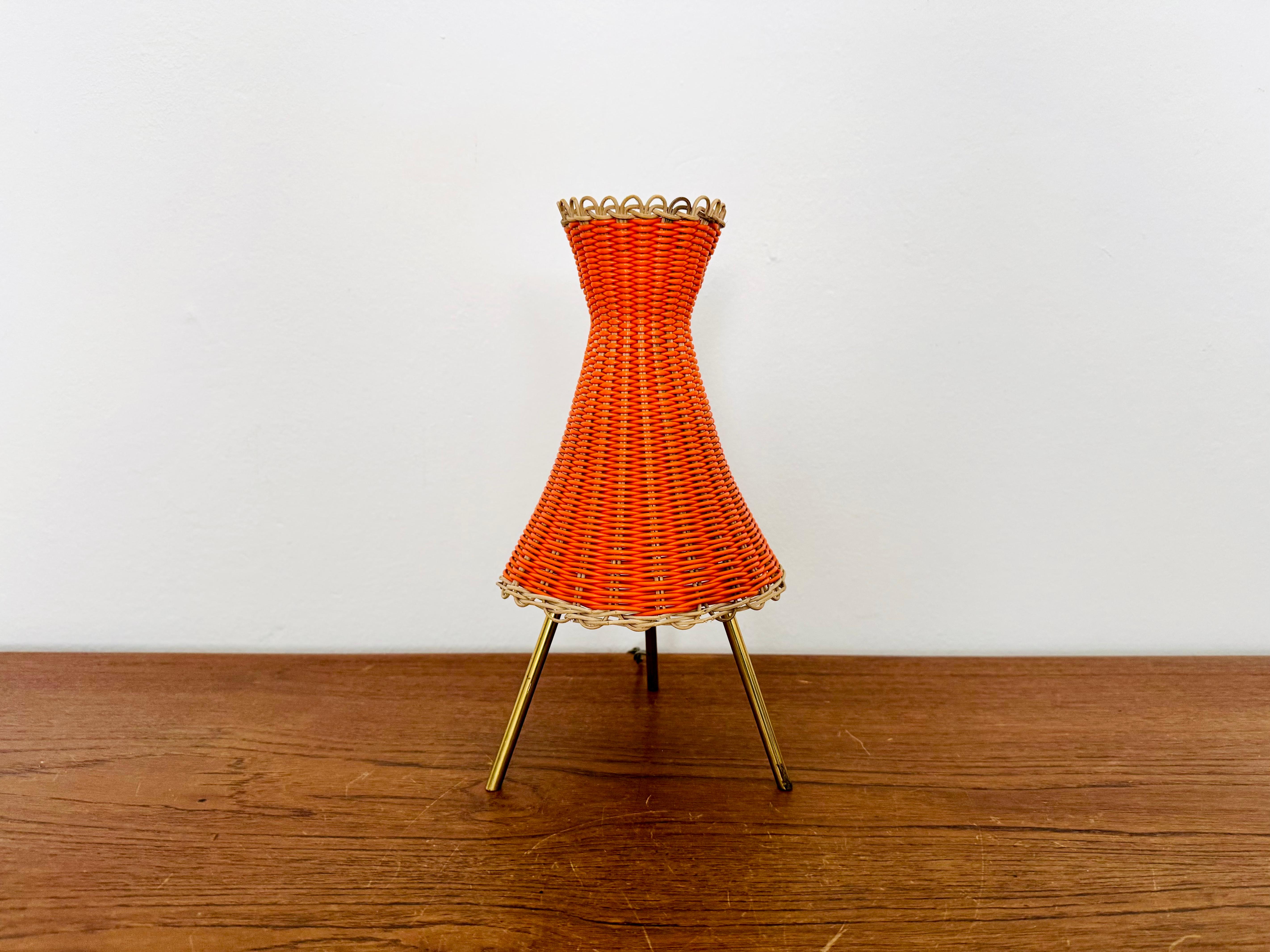 Wonderful Kiwi table lamp from the 1950s.
Great and exceptional design with a fantastically elegant look.
The rattan lampshade creates a very cozy atmosphere and a spectacular play of light.
Very rare collector's item with original